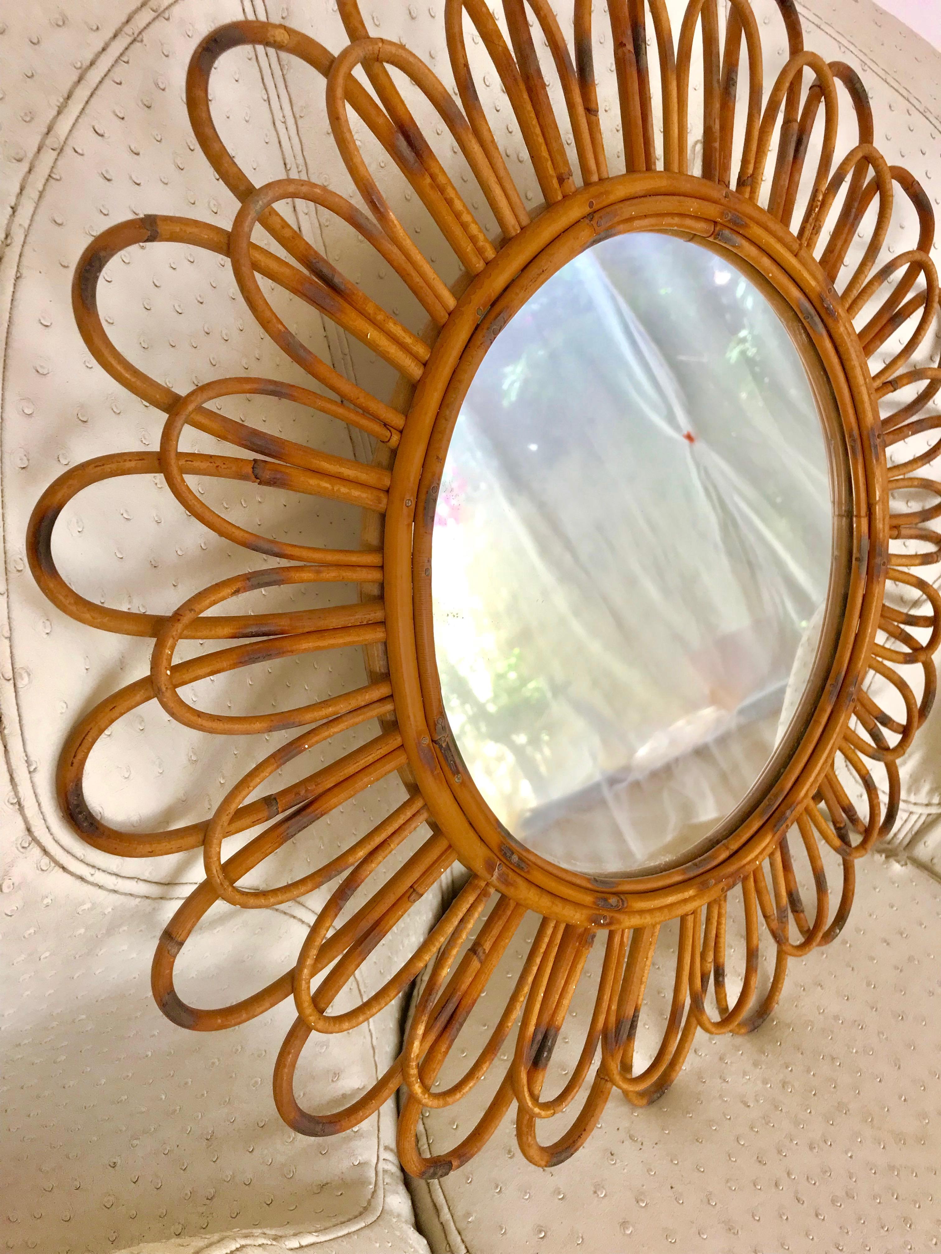 Lovely handcrafted rattan sunburst shape details.
This piece has all the taste of the Saint Tropez Riviera Mediterranean coast style and it is in excellent vintage condition. 
South France Riviera, 1950s.
Beautiful to place in a wall decoration