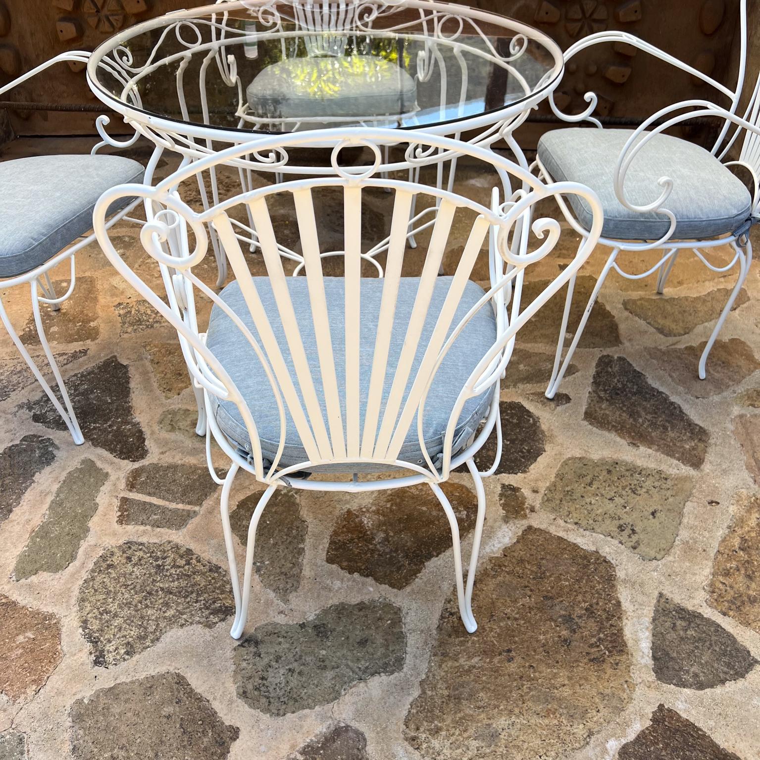 1950s French Sculptural Wrought Iron Patio Garden Set
In the style of René Prou
Dining Table and 4 Chairs
Table 28 h x 35.5
Chair 35 h x 20.5 w x 18 d Seat 19 Arm 26.25
Vintage set restored.
Fresh powder coat finish in flat white.
New Light Blue