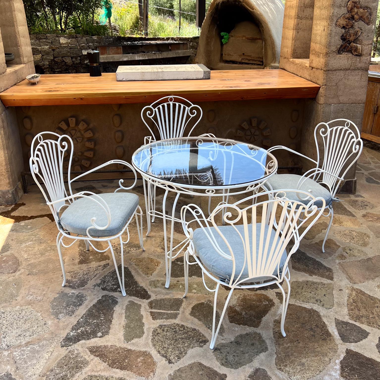 vintage white wrought iron table and chairs