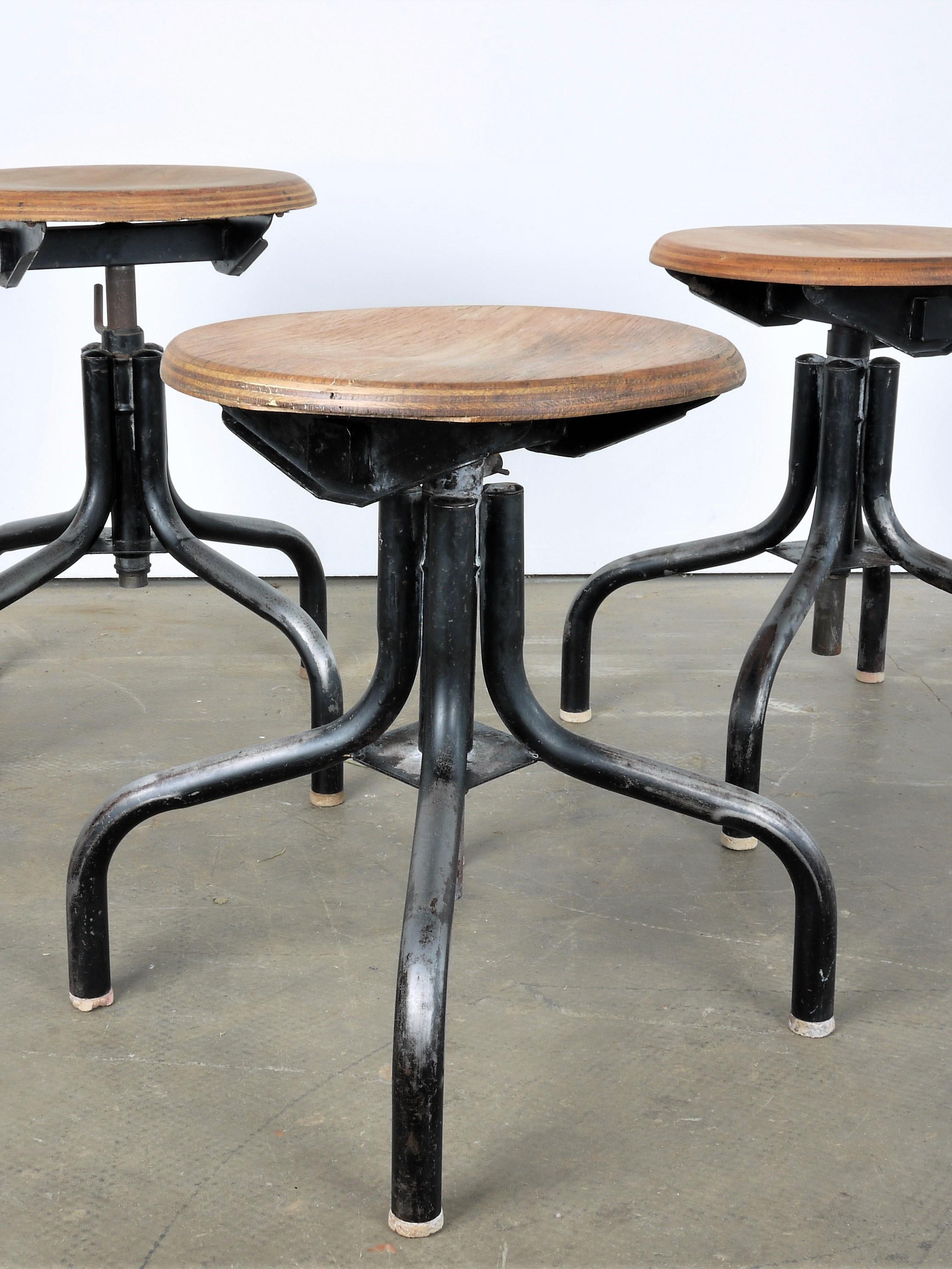 1950s French set of three low industrial/machinists stools
1950s French set of three vintage low industrial/machinists stools. Lovely honest set of three French stools with height adjustable and swiveling seat. Seats are solid laminated Beech.