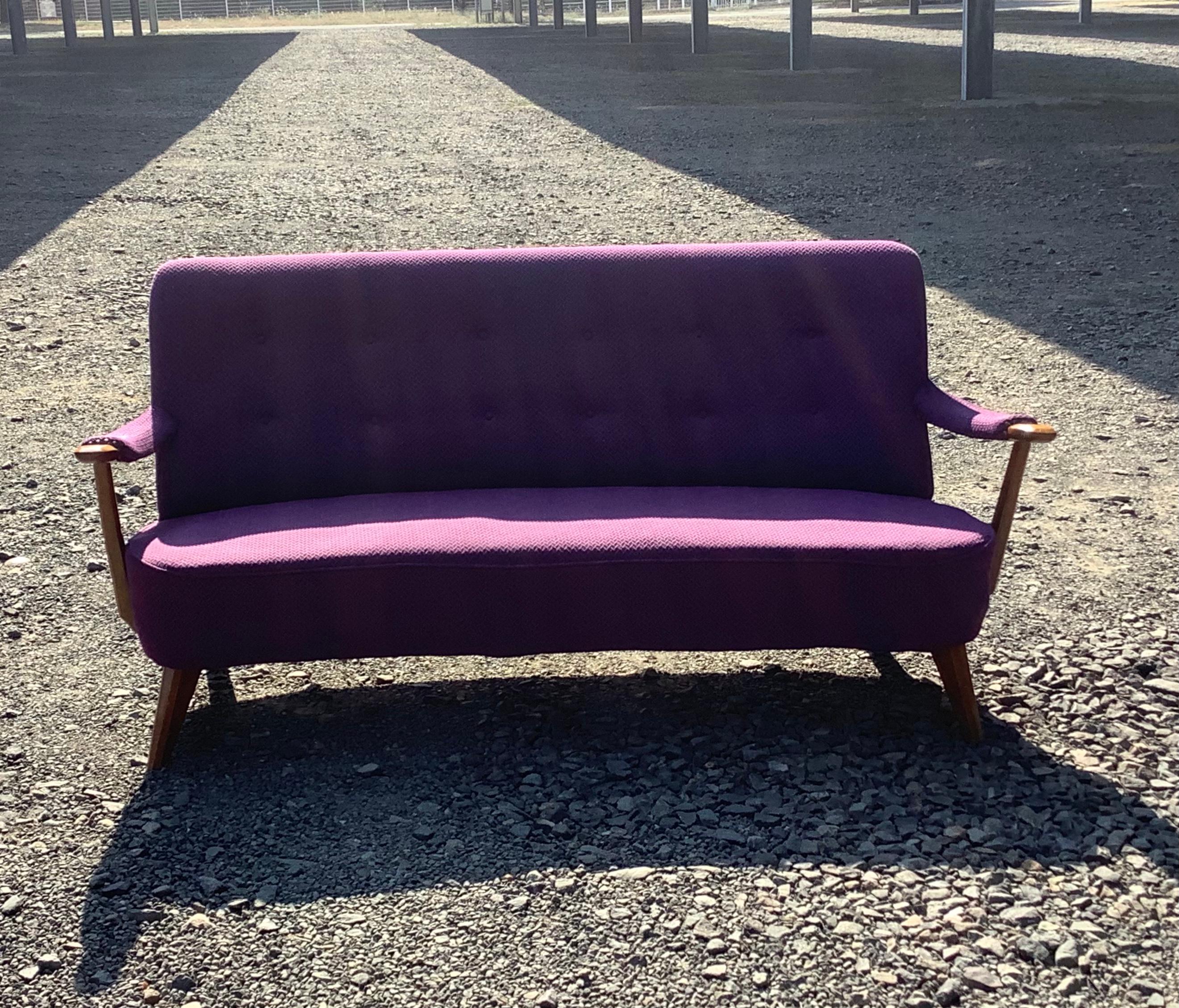 1950’s French 3 seater sofa with wooden arms deep purple upholstery. Bottom back high back design.