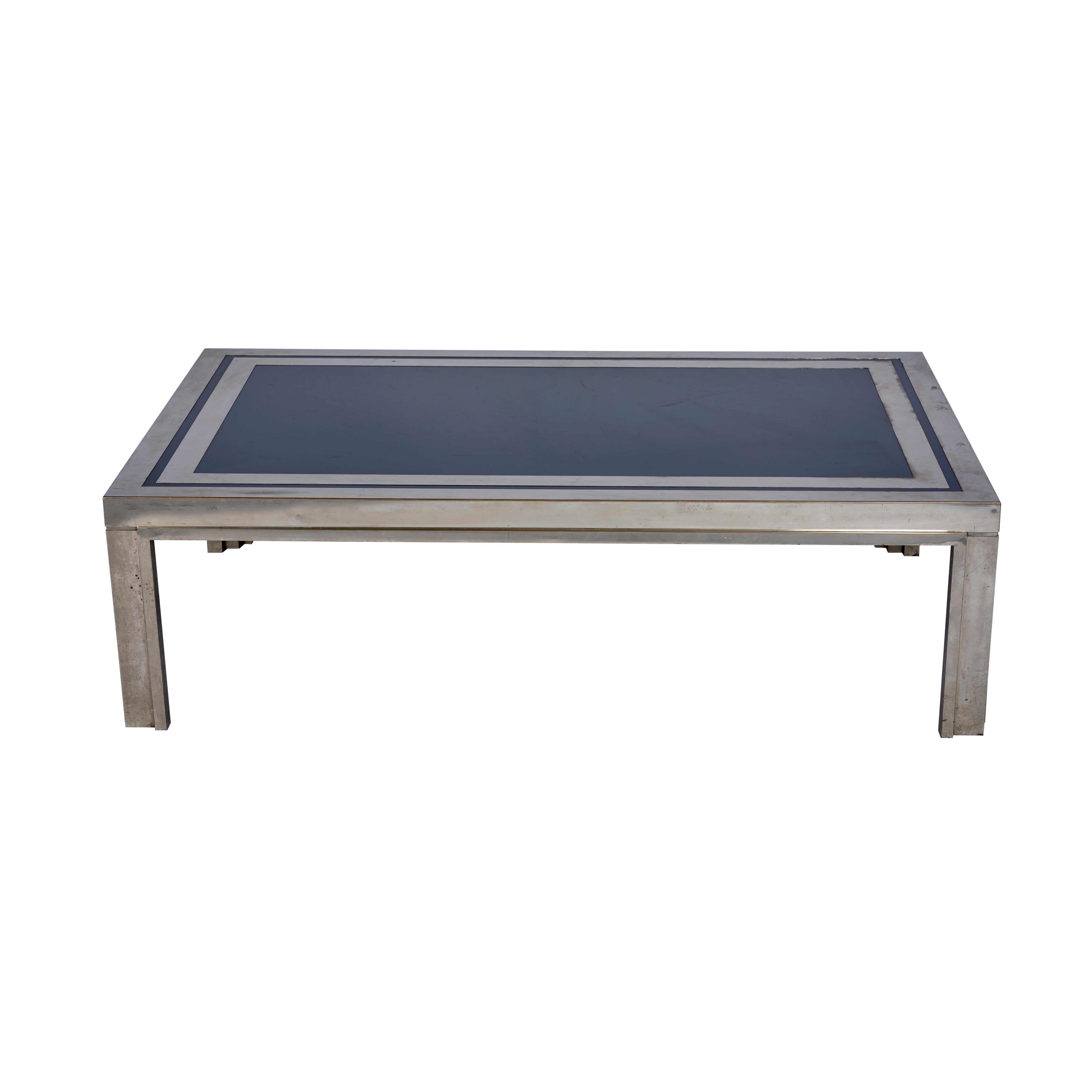 This Midcentury French steel with navy enamel top coffee table is chic and substantial.

Since Schumacher was founded in 1889, our family-owned company has been synonymous with style, taste, and innovation. A passion for luxury and an unwavering