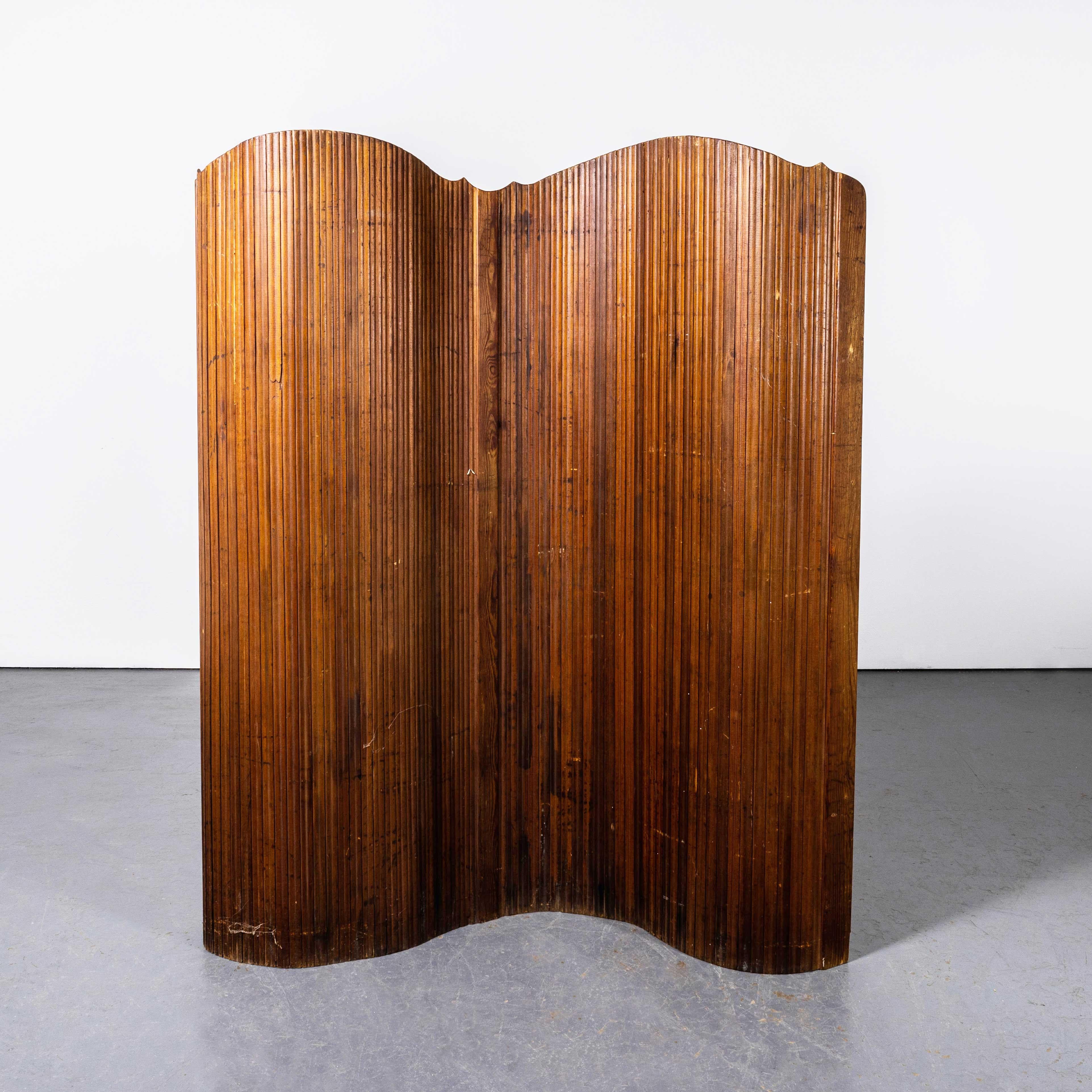 1950's French Tambour Screen By SNSA. 

Good quality screen made by SNSA in pitch pine tambour construction. The screen rolls up and can can be used in an organic way as a self standing screen or room divider.

Workshop Report:
Our workshop team