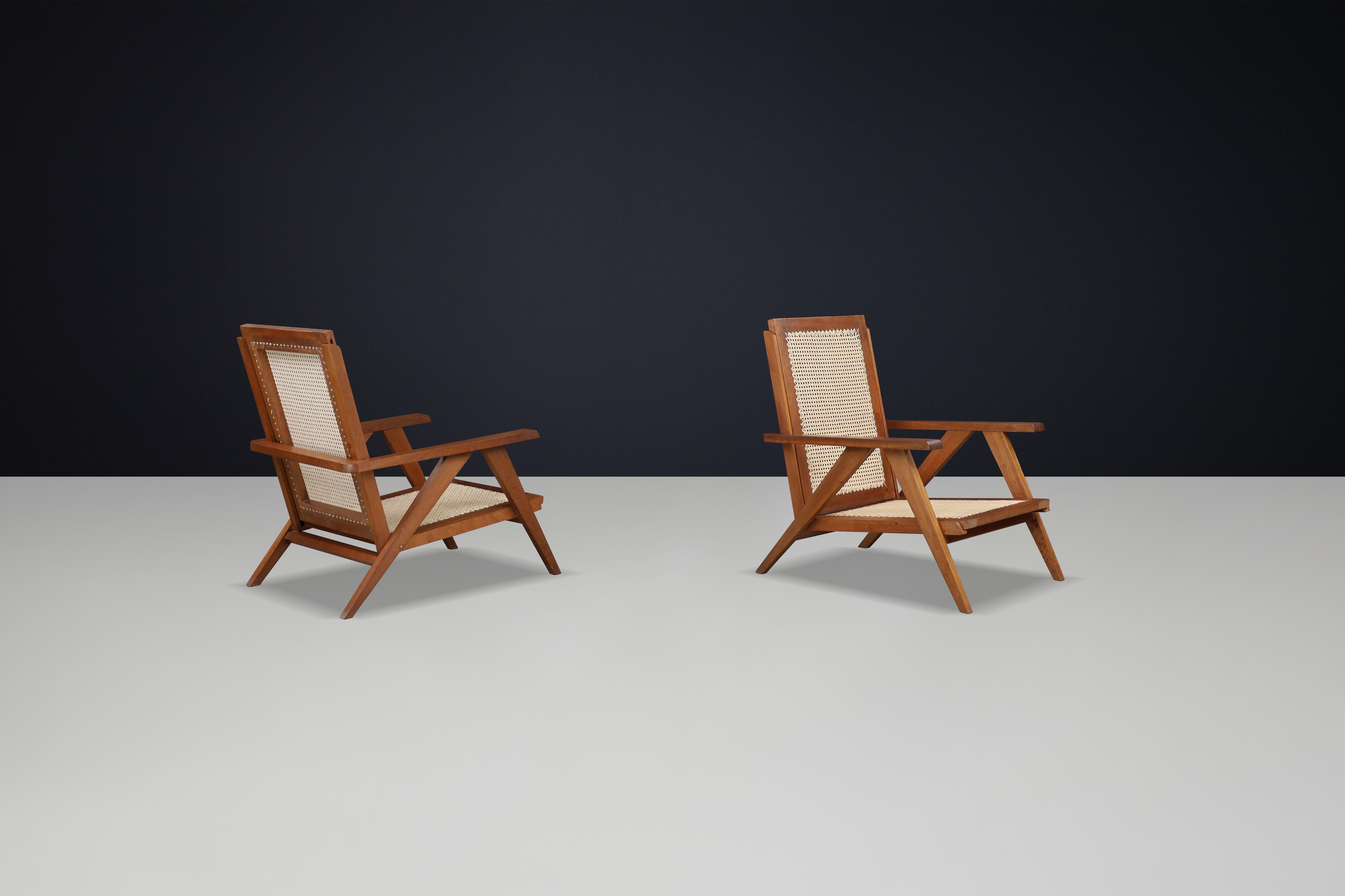 Fauteuils en teck et cannage français des années 1950 - Mid-Century Modern Icons Bon état - En vente à Almelo, NL