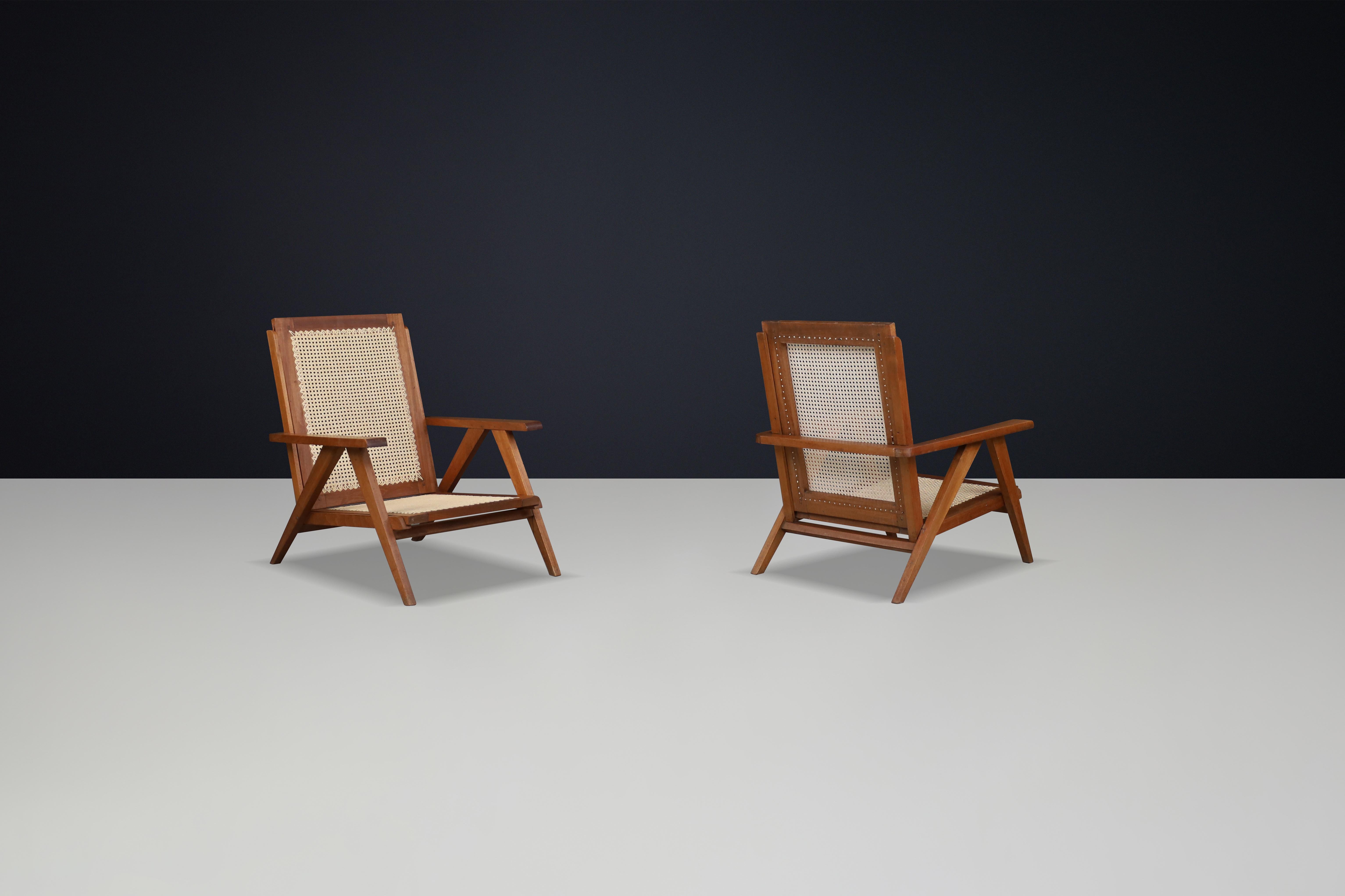 Milieu du XXe siècle Fauteuils en teck et cannage français des années 1950 - Mid-Century Modern Icons en vente