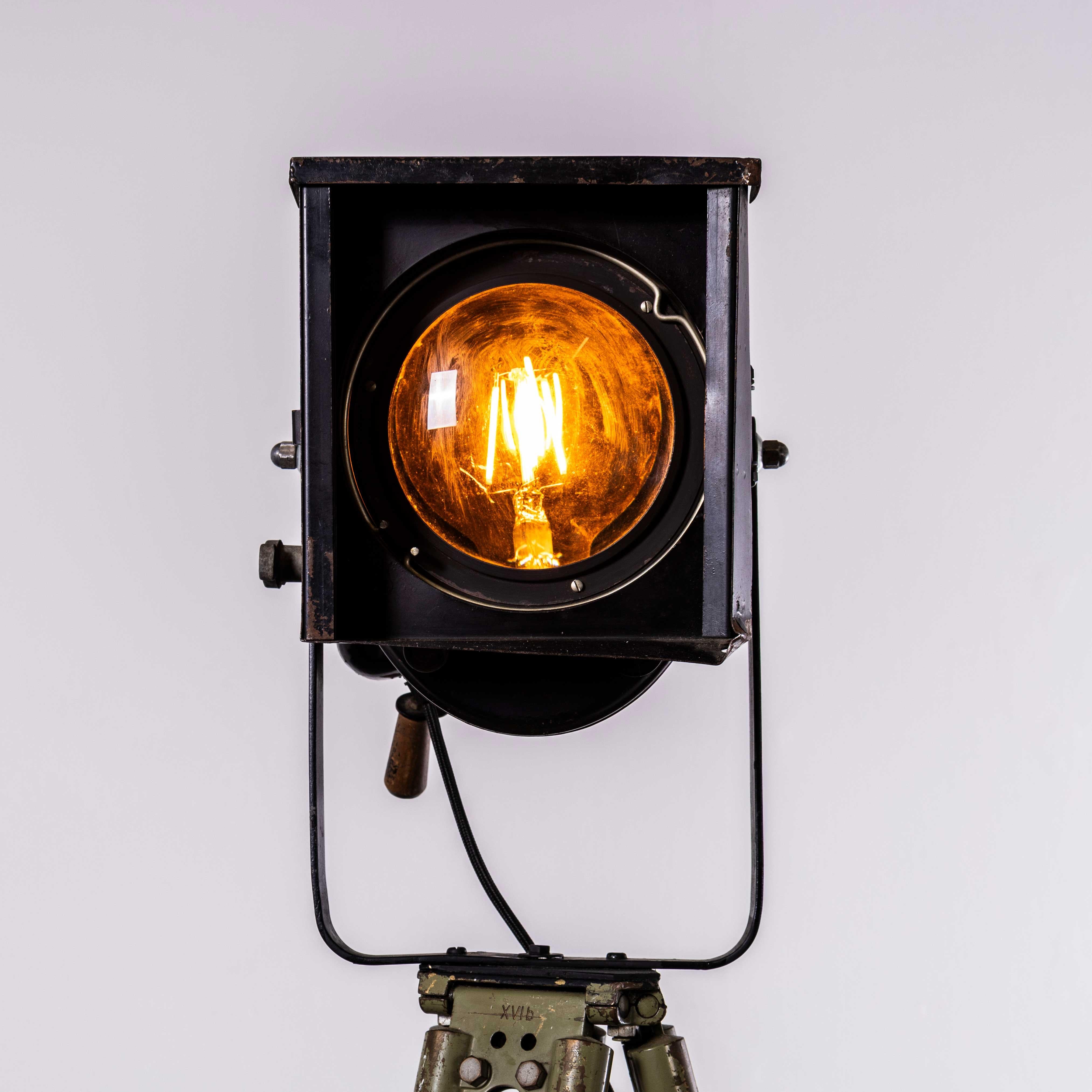 1950’s French Theatre Spot Lamp On Tripod Stand. 

Well made and engineered, the lamp is an original theatre lamp fitted to an adjustable birch tripod base. The tripod is height adjustable and the lamp swivels and is adjustable. The lamp has been