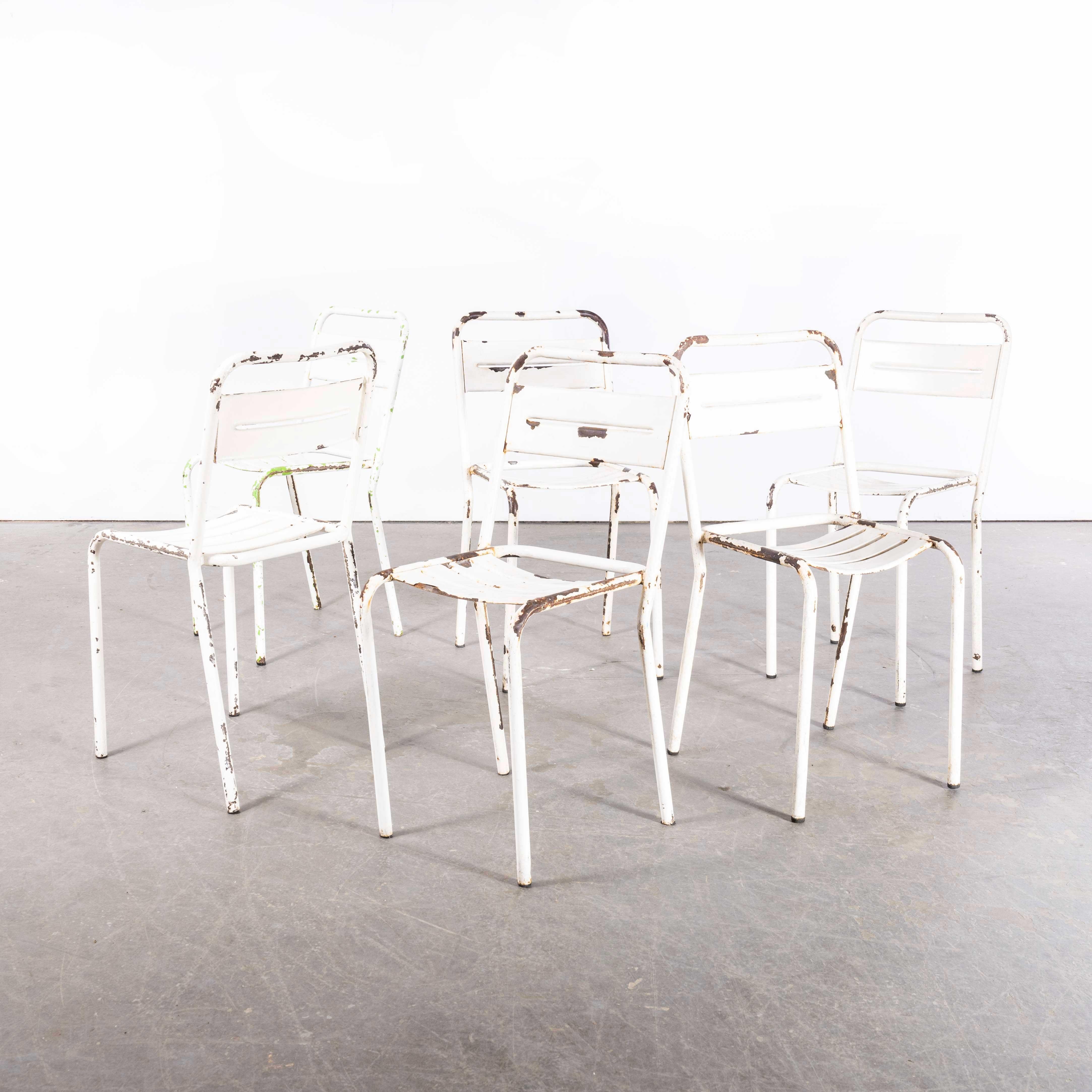 1950's French  White Metal Stacking Outdoor Chairs - Set Of Six

1950's French  White Metal Stacking Outdoor Chairs - Set Of Six. Reminiscent of Tolix but not made by Tolix, this style of chair was industrially produced in the 1950’s by various
