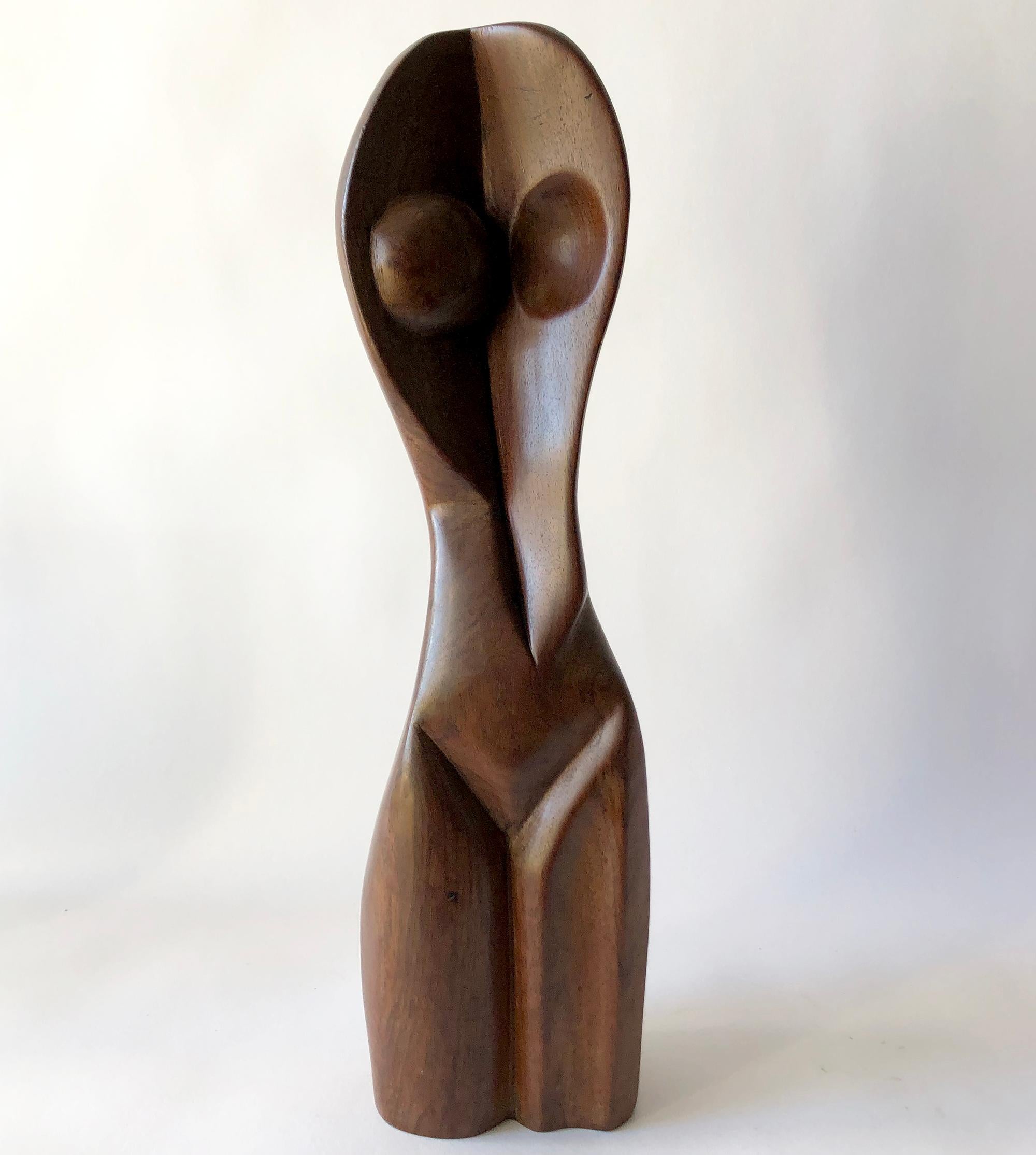 Heavy, carved wood female torso sculpture created by G. Numa. Sculpture measures 16