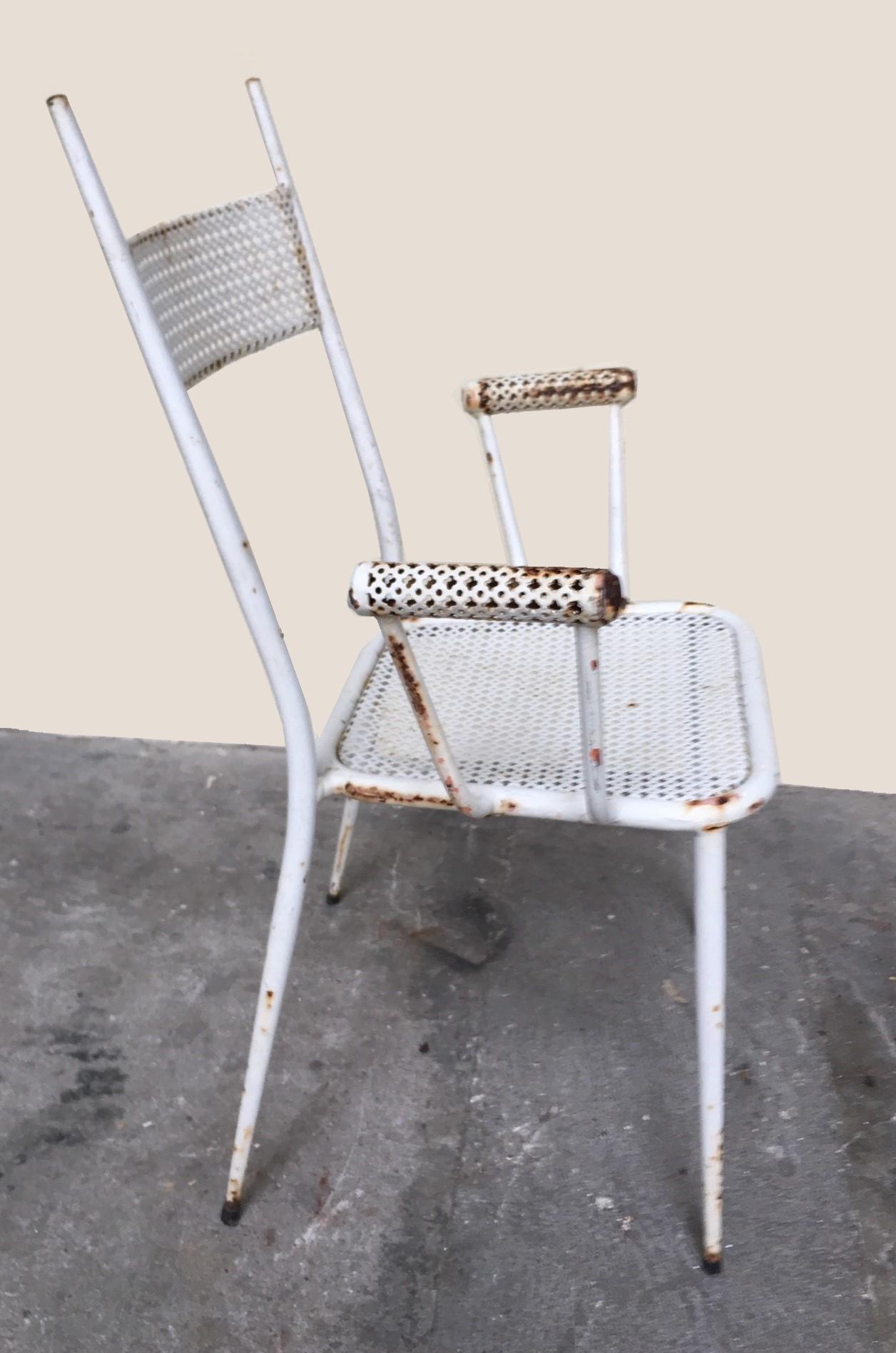 Garden furniture in metal and perforated sheet including a table, two chairs and two armchairs.
France circa 1950 in the style of Mathieu Matégot.

Table dimensions:
Height 26.77 in
Width 31.50 in
Depth 31.50 in

Chairs dimensions:
Height