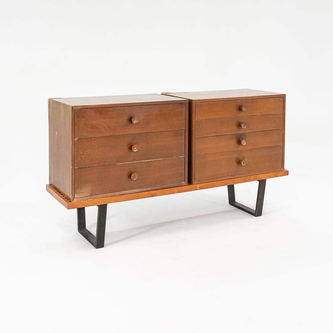 This is an uncommon Walnut Cabinet with four drawers, Model 4606, designed by George Nelson for Herman Miller in 1946. This design was part of George Nelson's Basic Cabinet Series. The listed price includes the cabinet itself but does not include