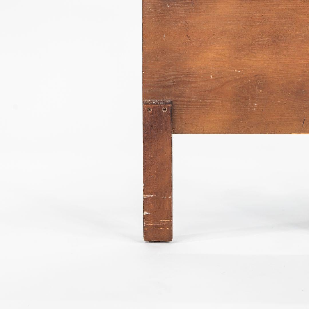 This is a Walnut Full-Sized Headboard, designed by George Nelson for Herman Miller in 1952. This design was part of George Nelson's Thin Edge Series. It features a construction of both solid walnut and walnut veneer. 
 
 The headboard measures 2