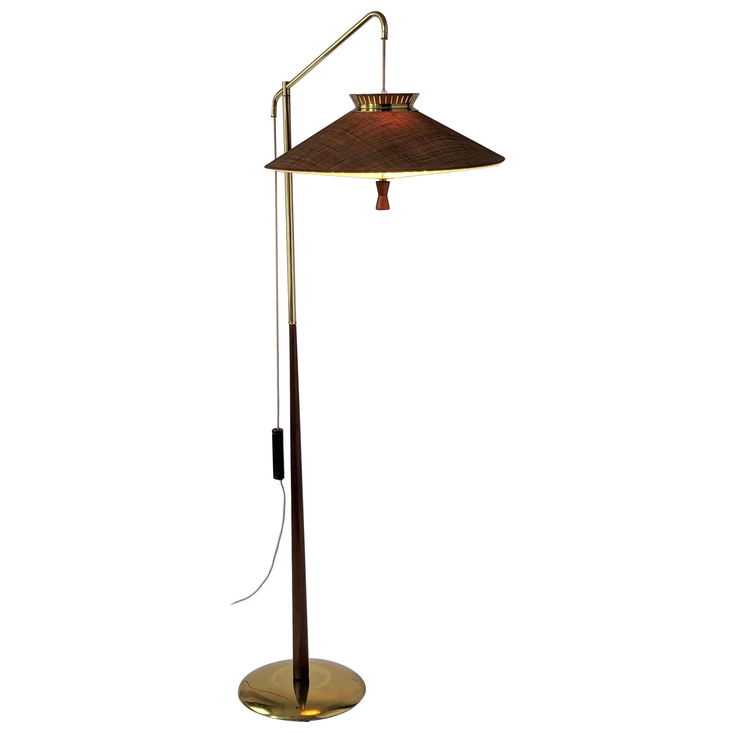 Elegant, bold floor lamp with a lot of personality and presence.

Solid well made construction. 

The counterweight work perfectly, permitting easy shade height adjustment from 59 in. to 29 in. from ground.

Asian inspired vented burlap shade