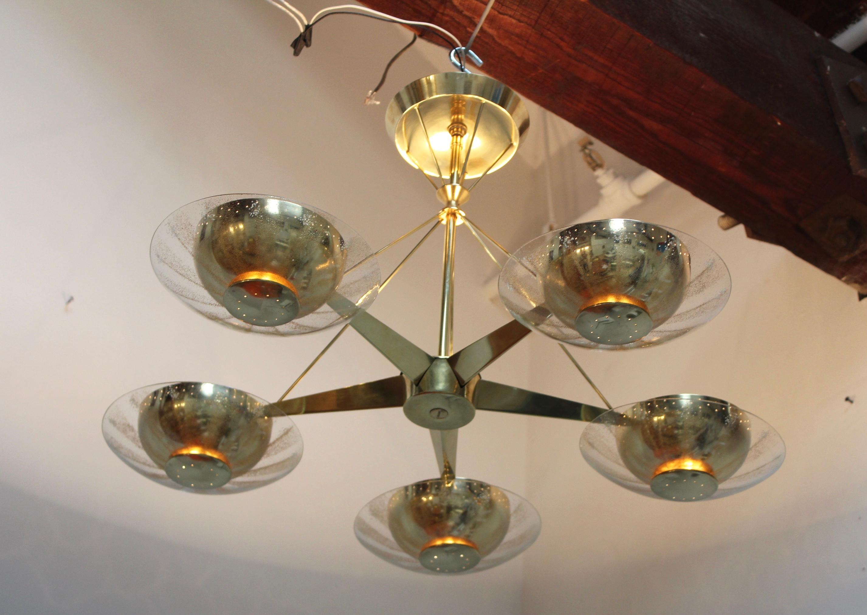 1950s Gerald Thurston for Lightolier brass and glass 5-arm chandelier, the brass have been lightly hand polished. Newly rewired and ready to use.

Two chandeliers are available.