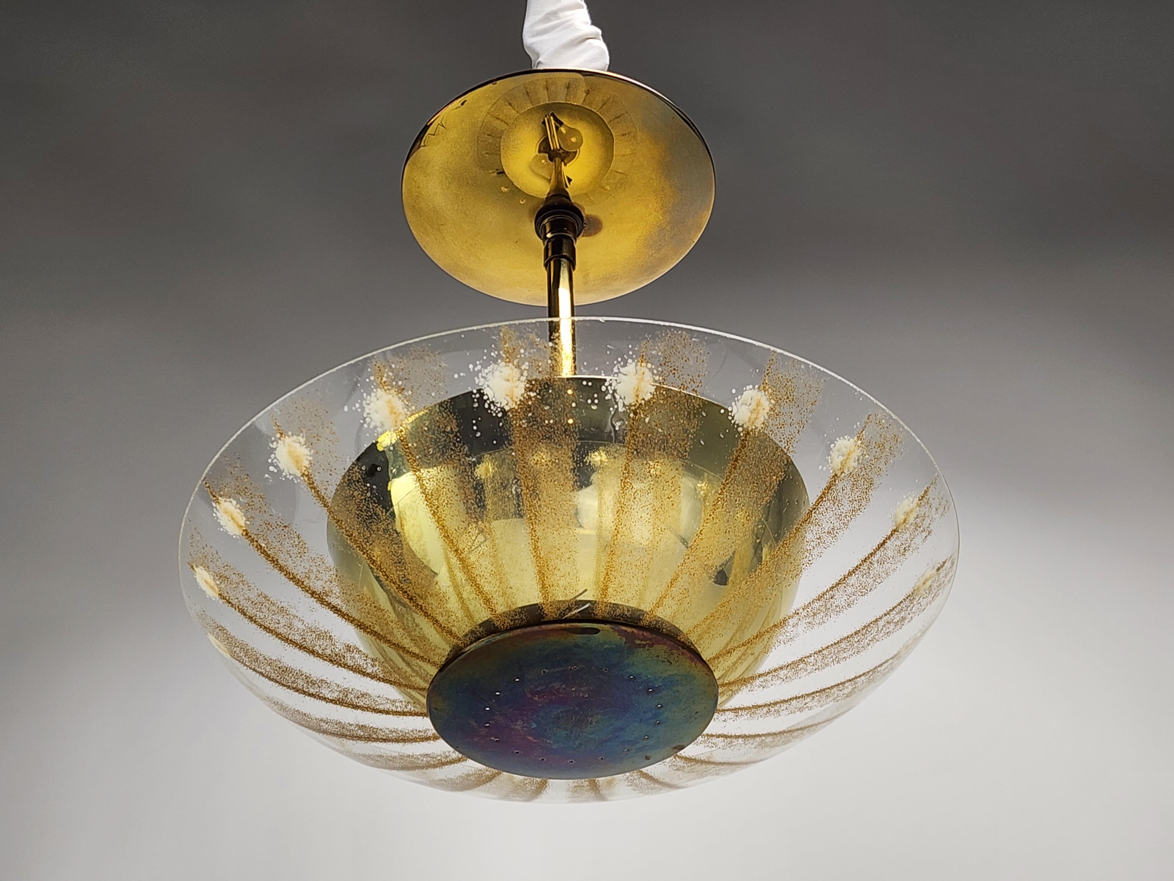 Gerald Thurston pendant. 

Texturized gold powdered stripe on glass shade, brass pierced cup and pierced large ring under add sparkling detail on this fixture. 

Contain 2 E26 size socket rated at 60 watt each.