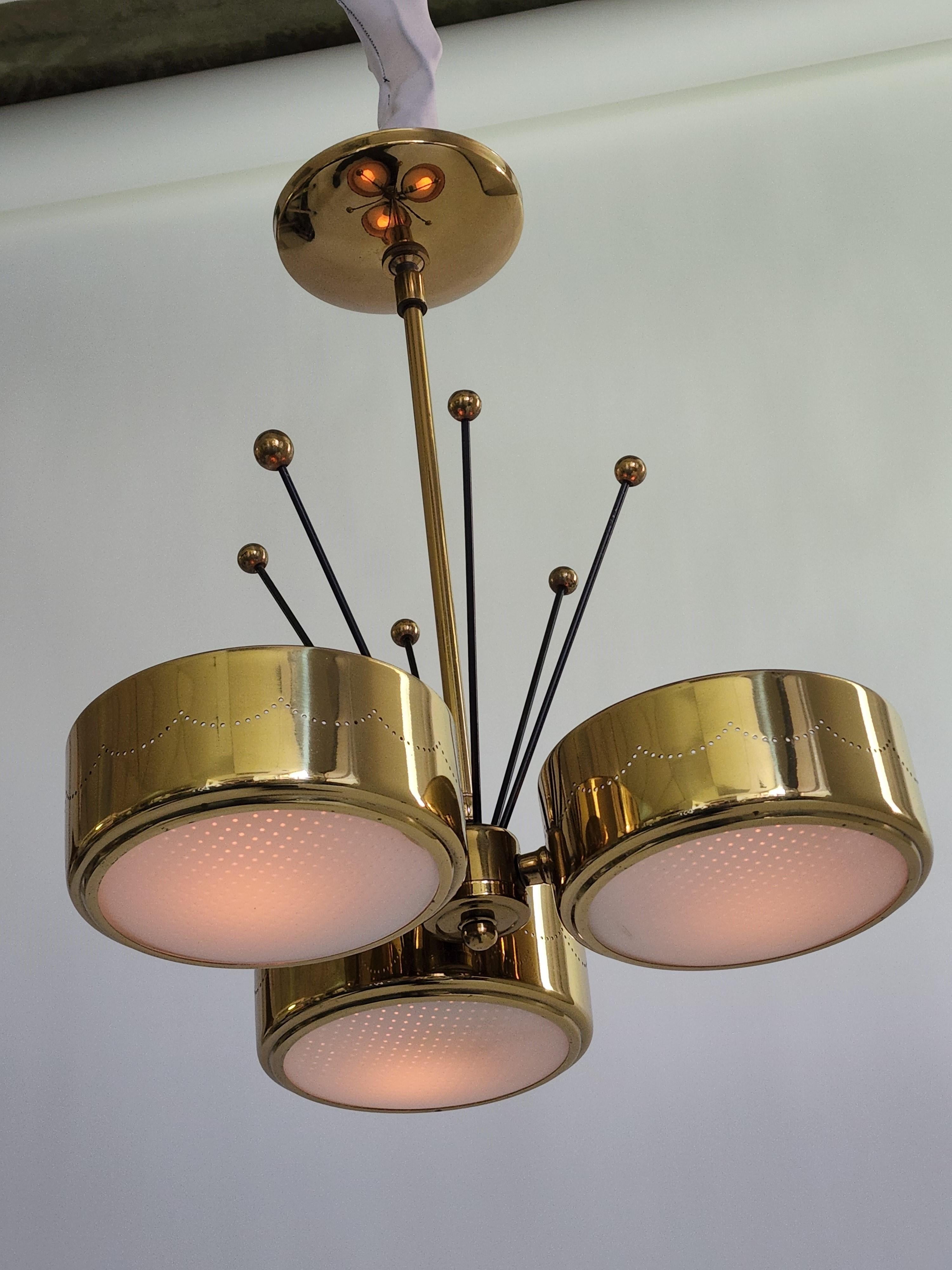 Gerald Thurston pendant made of brass plated pierced aluminium shade, sputnik enameled black steel rod toped with solid brass ball, completed with an opale convex glass diffuser under. 

Measure 14.5 wide by 17 in. high. 

Each shade measure