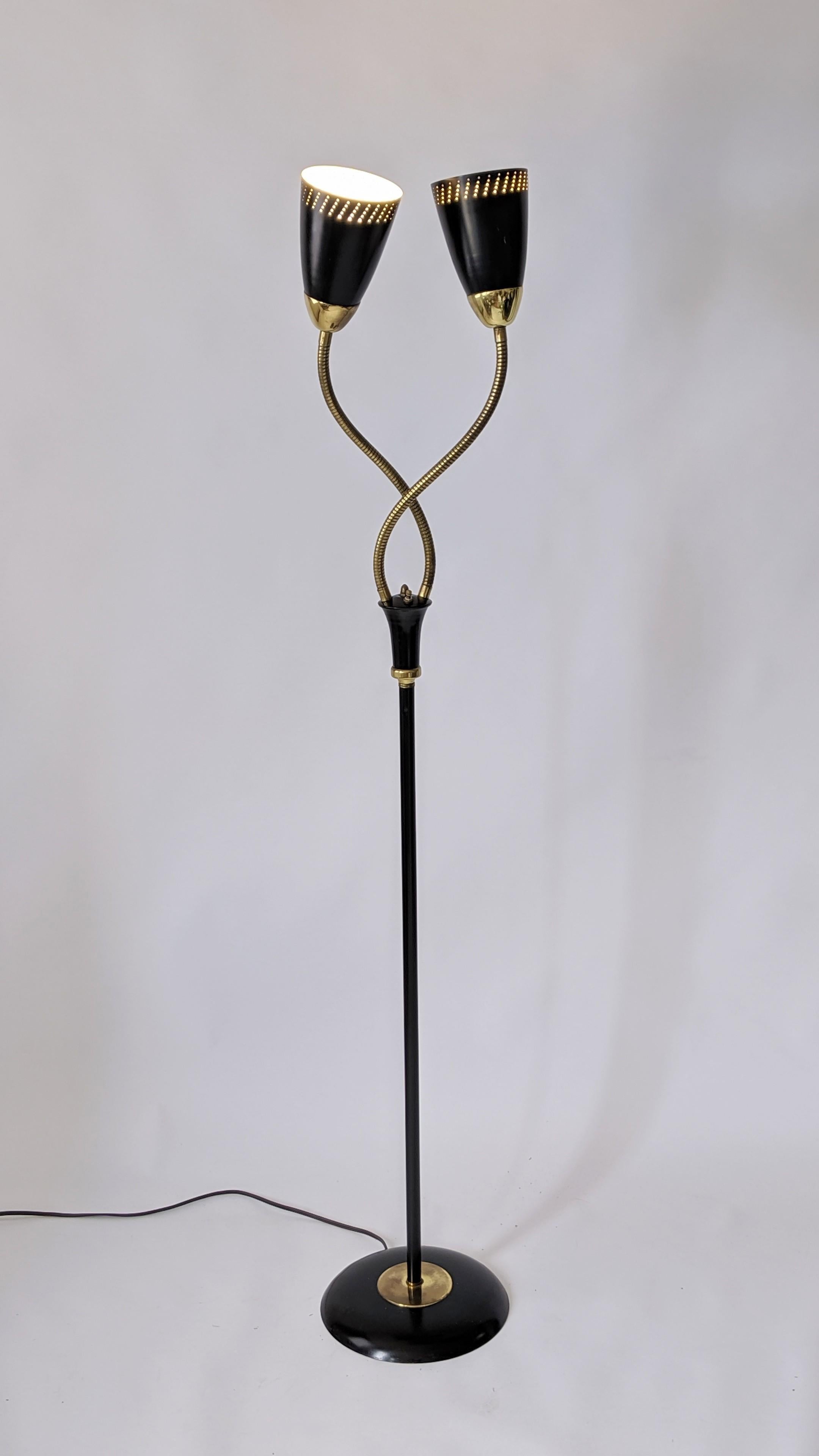 Create many sculptural shape with this twin brass goosneck floor lamp from Gerald Thuston for Lightolier. 

The enameled black semi gloss pierced shades contain one E26 socket rated at 60 watt.

Solid, well made construction with prime quality