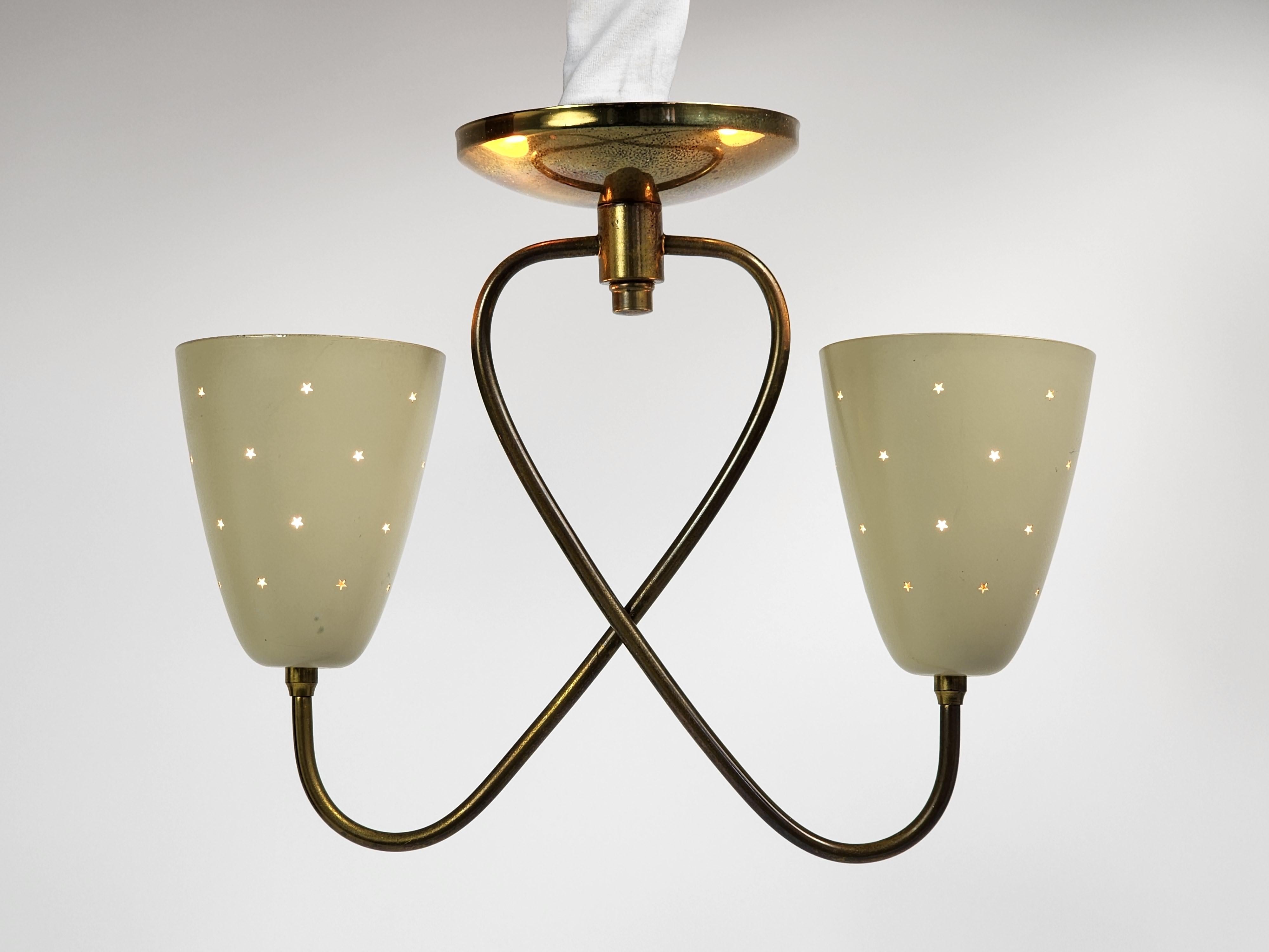 Gerald Thurston twin shade pendant for Lightolier, USA

Stars pierced motif enameled aluminium shade sitting on a brass structure. 

Contain two E26 size socket rated at 60 watt each. 

