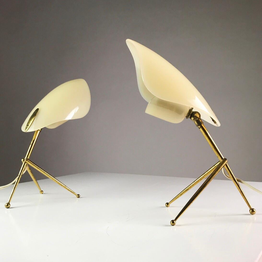 Made in the 1950s by WKR Offenbach am Main in Germany. 

Elegant and sophisticated table lights from the Stilnovo modernistic era made from solid brass and thick off white perspex shades. 

The shape of the large perspex reminds of the leaf and