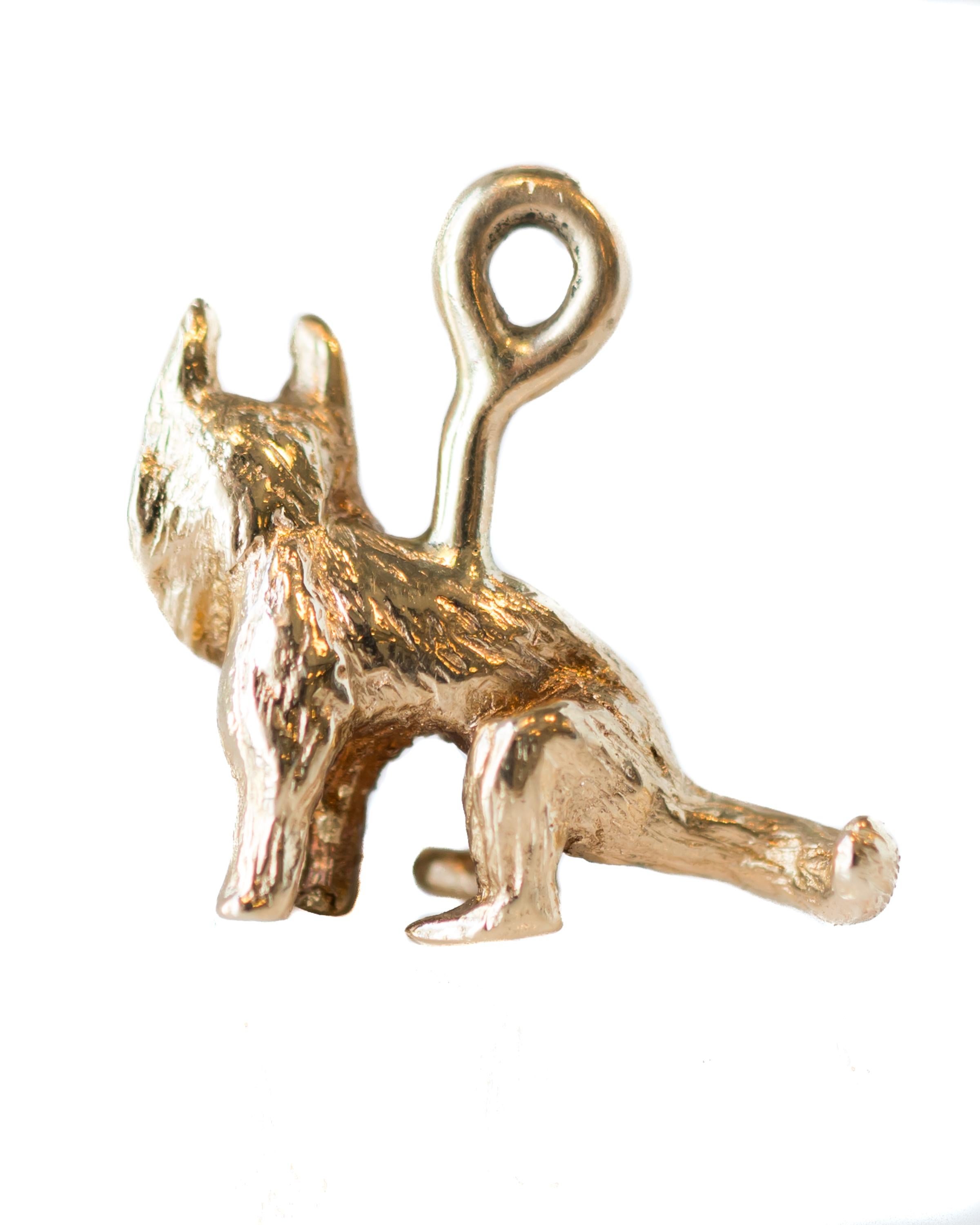 1950s Retro German Shepherd Dog Charm - 14 Karat Yellow Gold

Features:
Tiny Seated German Shepherd Dog with full ruff and tail and big ears
Very Detailed Design
Textured 14 karat Yellow Gold
Sturdy Bail 
Measures 15 x 15 millimeters 

Charm