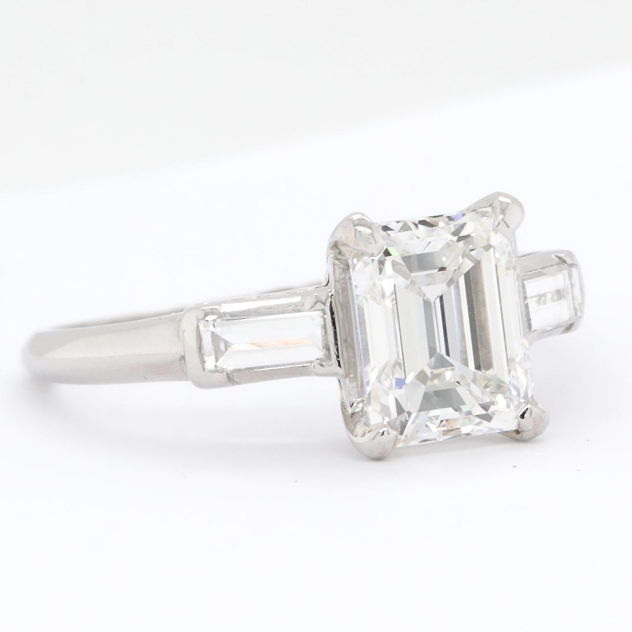 Classic and timeless, this 1950s emerald cut diamond ring is absolutely stunning. If emerald cuts are an option, this ring is the perfect engagement ring. The light softly bounces through the facets of the diamond and totally steals your heart! The