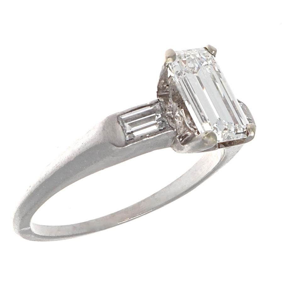 At just under one carat, this emerald cut diamond platinum ring is Retro at its finest. GIA certified 0.96 carat emerald cut with G color and VVS2 clarity. The diamond is perfectly framed in a substantial four prong platinum setting with beautiful