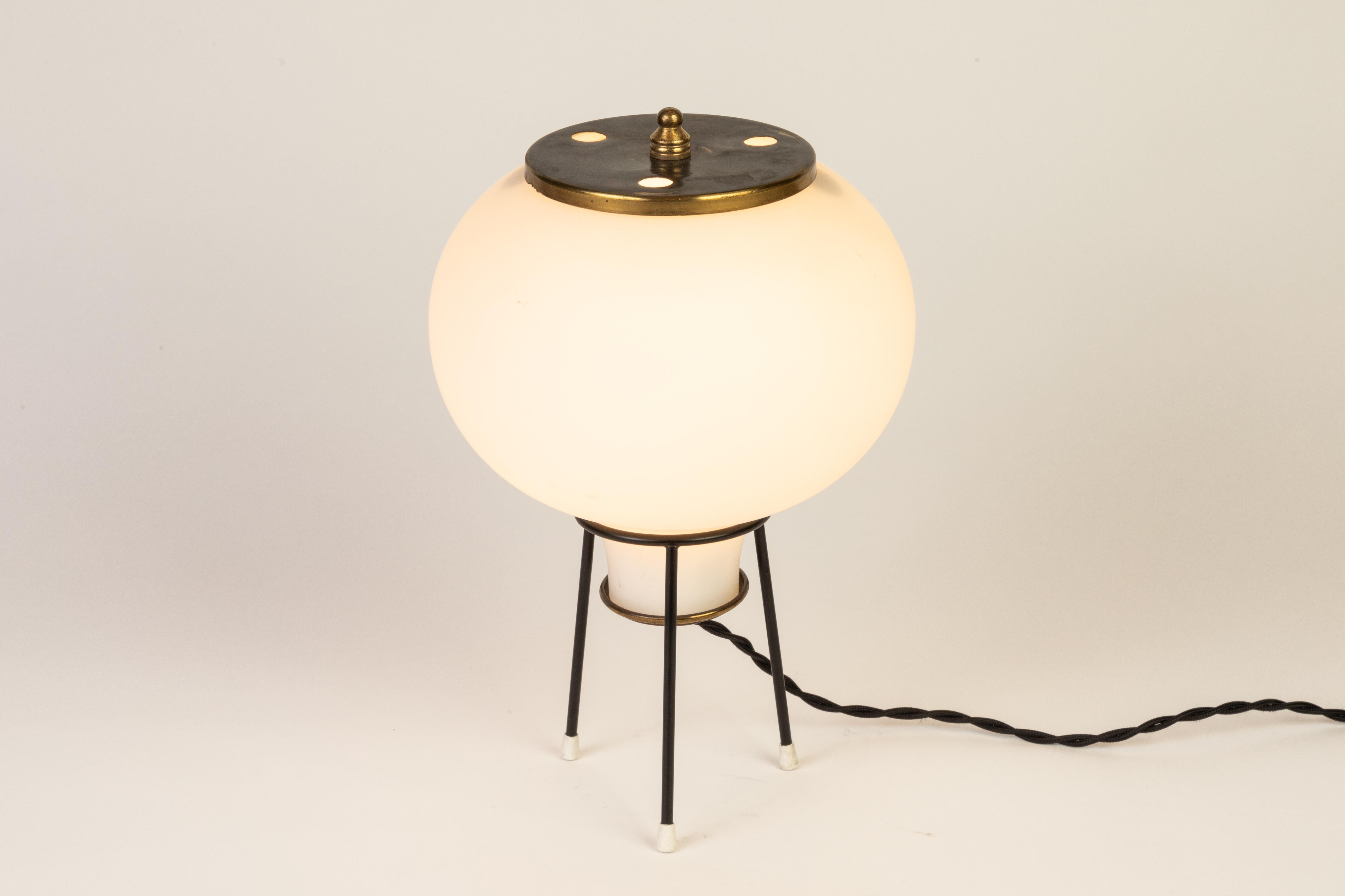 1950s Gilardi & Barzaghi glass tripod table lamp. A delicate and whimsical table lamp executed in opaline glass and brass and reminiscent of the midcentury designs of Stilnovo.

Professionally rewired for US electrical with double-twist cloth