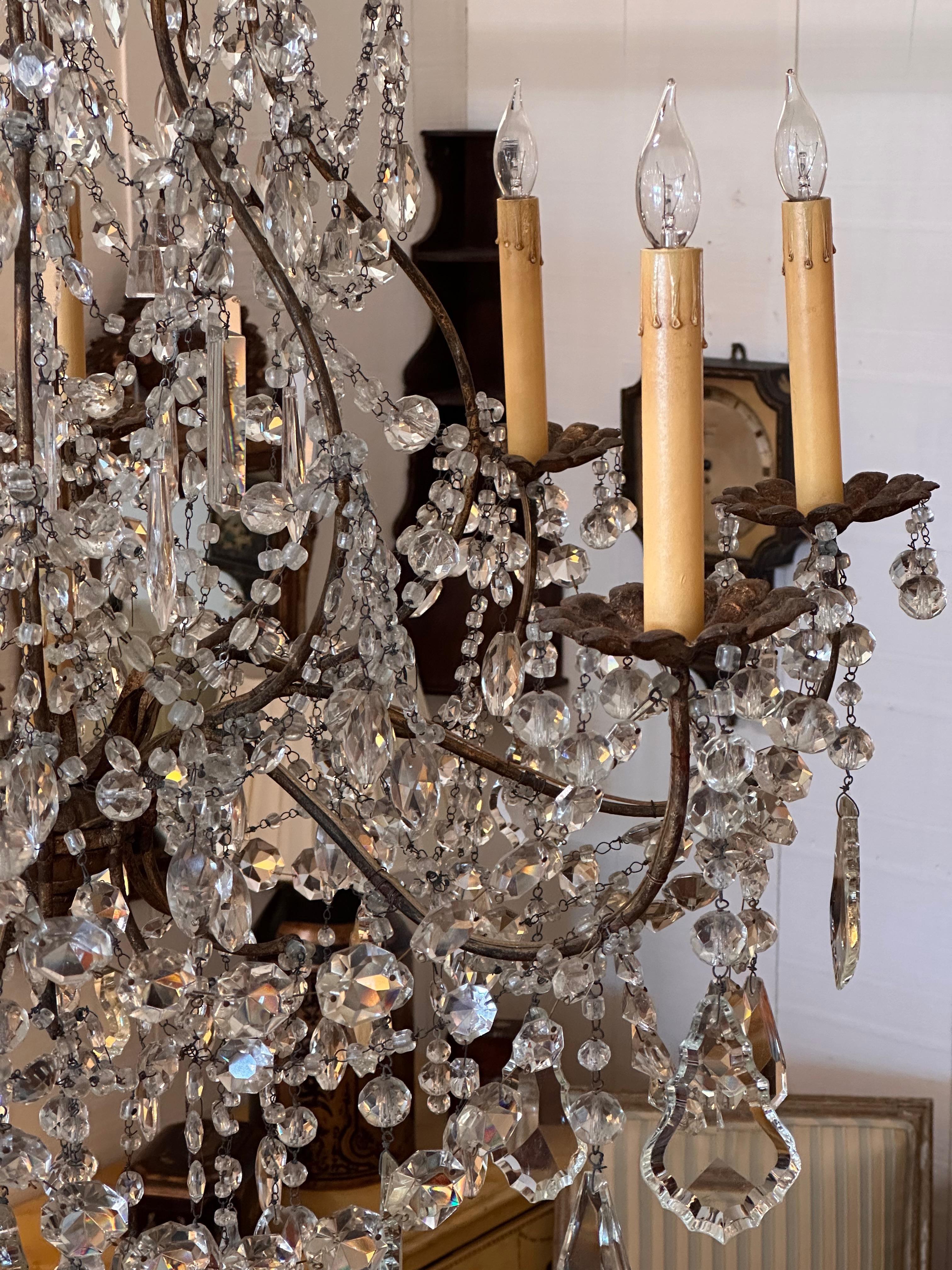Mid-20th Century 1950s Gilded Iron and Crystal Italian Chandelier For Sale