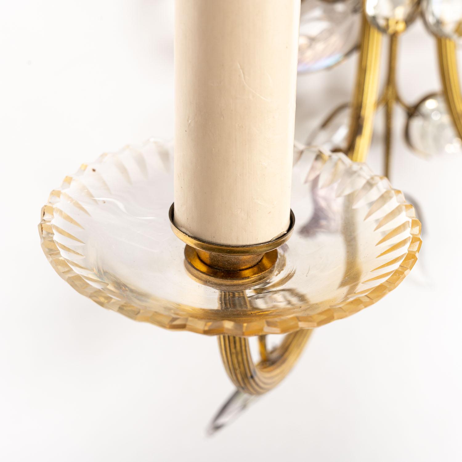 This stunning light attributed to Maison Baguès combines naturalistic design with ornate lighting. The decorative gilt-brass branches and base are the foundation for this florally-inspired piece. The central 'flower 'is an intricate mix of