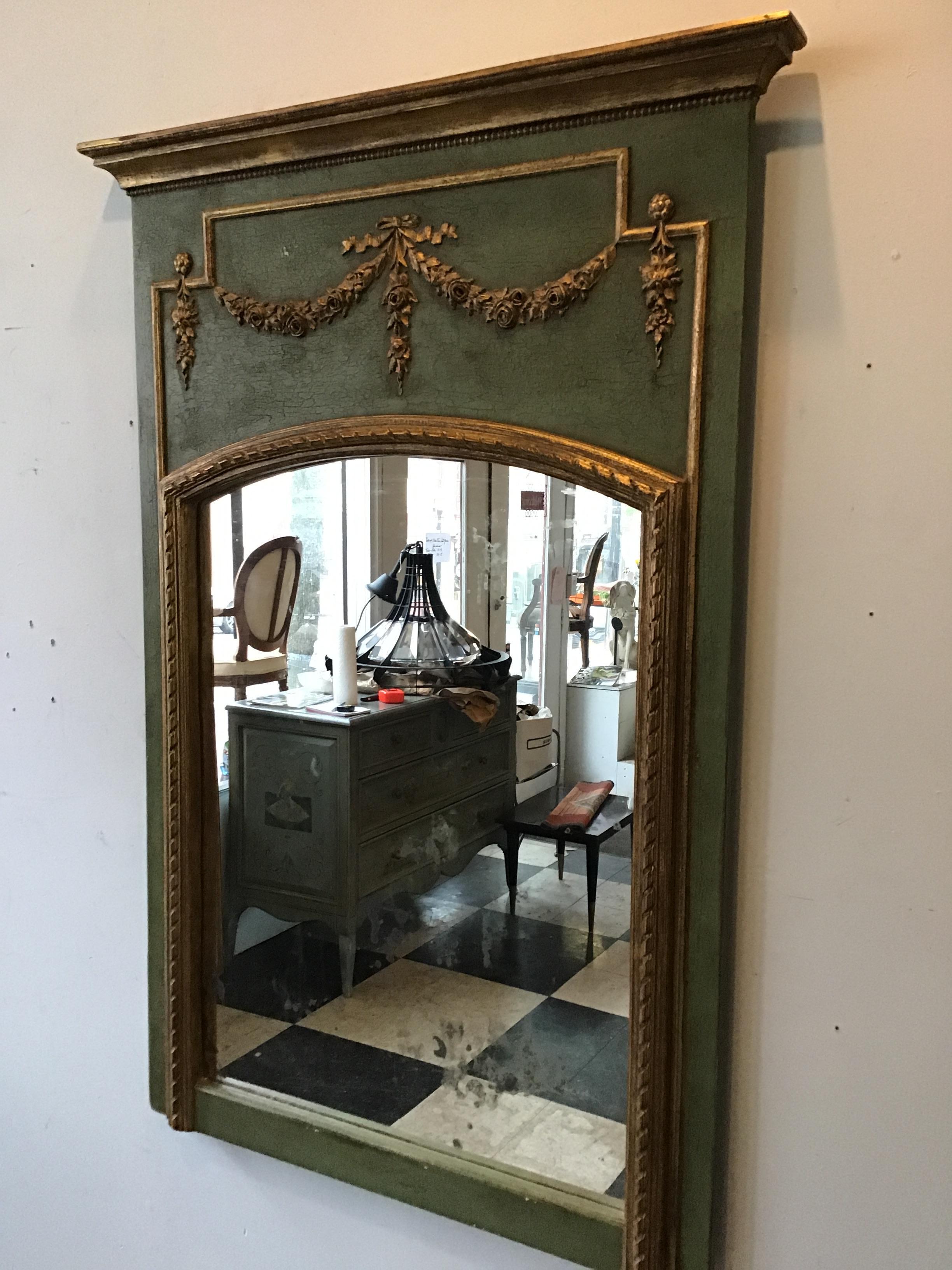 1950s  French green painted wood trumeau mirror with gilt accents.