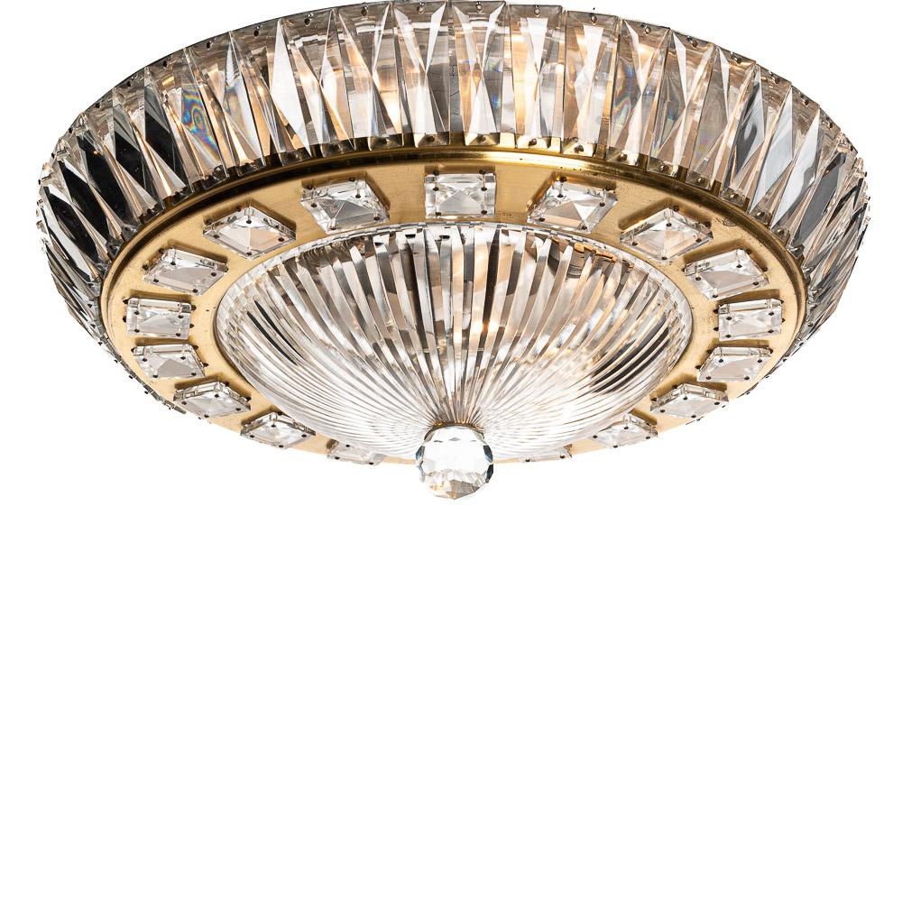 Stylish flush mount. Gilt metal frame with faceted square crystals surrounding the glass base and a crystal ball finish and glass rectangles surrounding the sides for more light. This opulent and unique piece is sure to catch the eye.