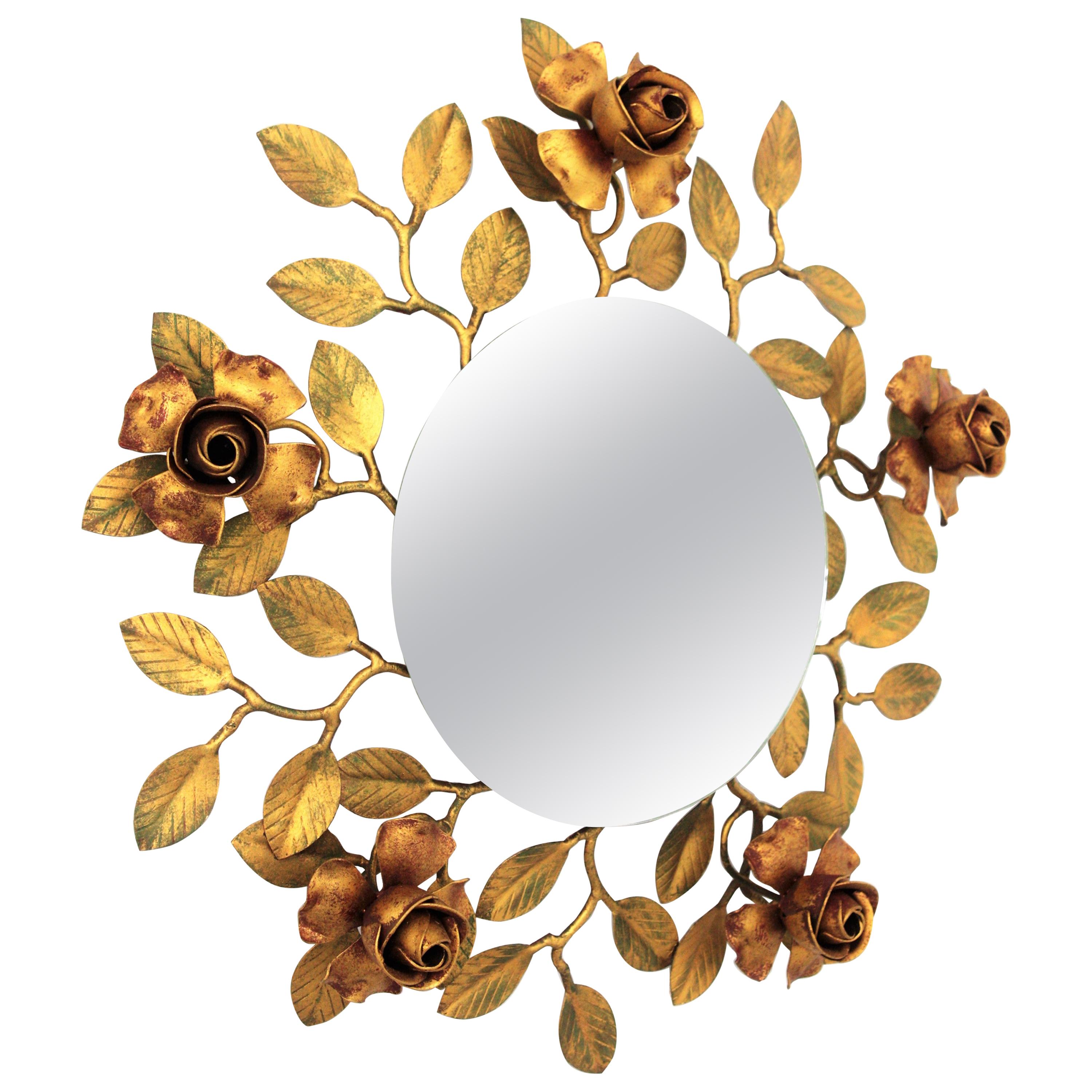 Hollywood Regency rosebush floral mirror in Polychromed gilt iron, Spain, 1950s
This lovely wrought gilt iron polychrome mirror has the shape of a rosebush tree. Surrounding the central glass depart iron branches with small green leaves, some of