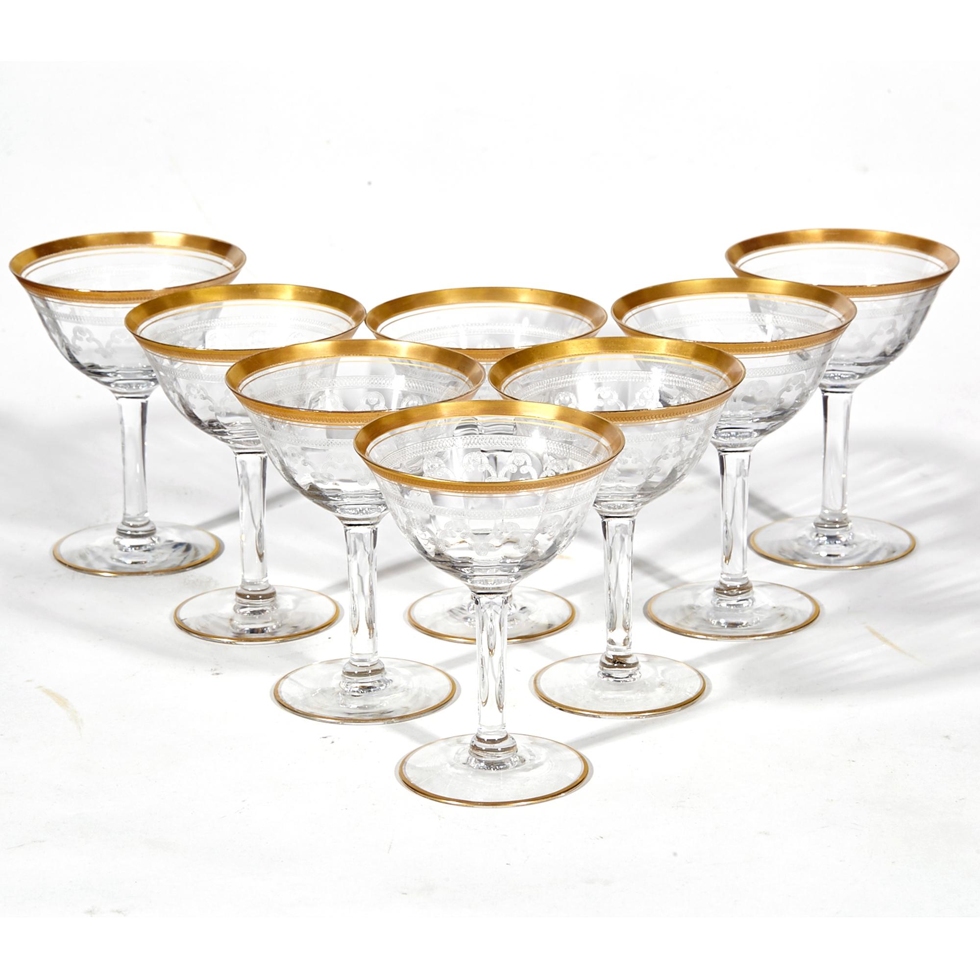Vintage 1950s set of eight floral gilt rim and etched clear glass coupes. No maker's mark.
 