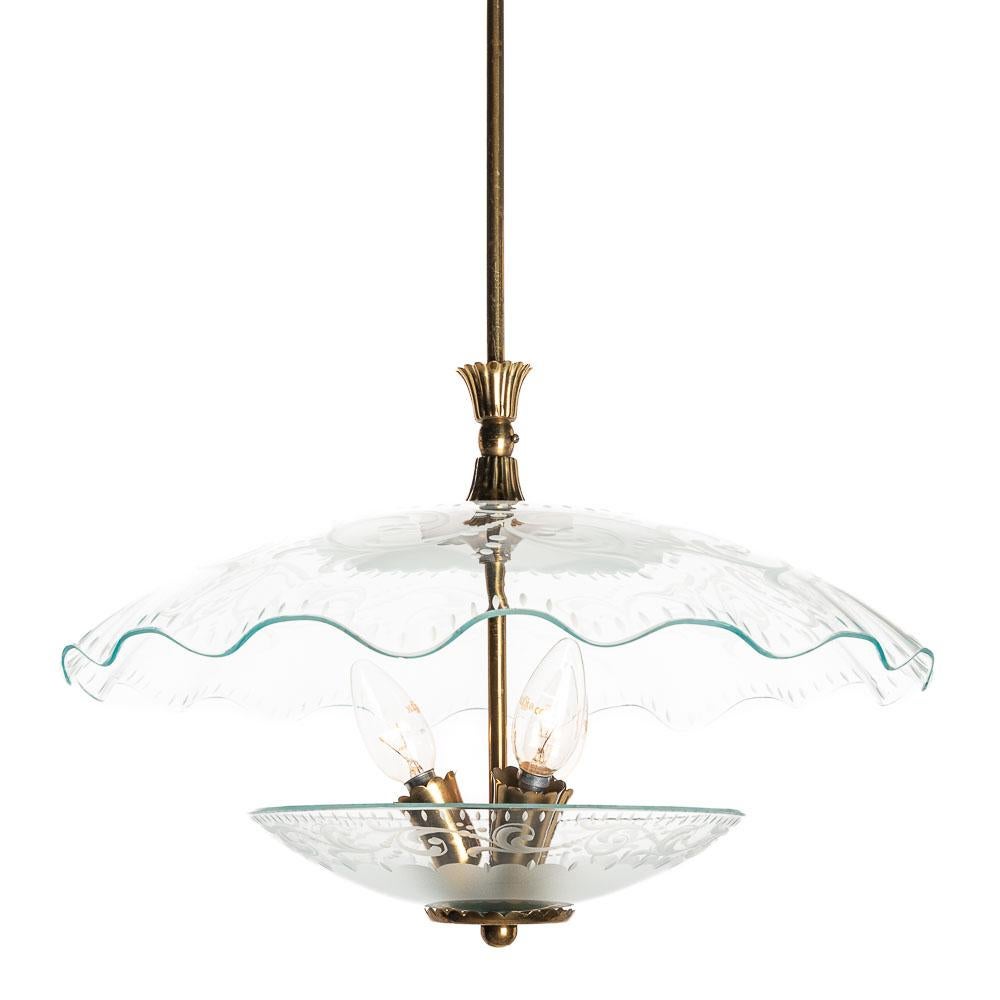 This elegant piece consisting of a brass frame and 2 unique frosted,etched and satin glass reflector/saucers. 
The lower round curved glass reflector mounts below a clear glass dish. In the center 3 electrical E14 sockets. Brass hardware and stem