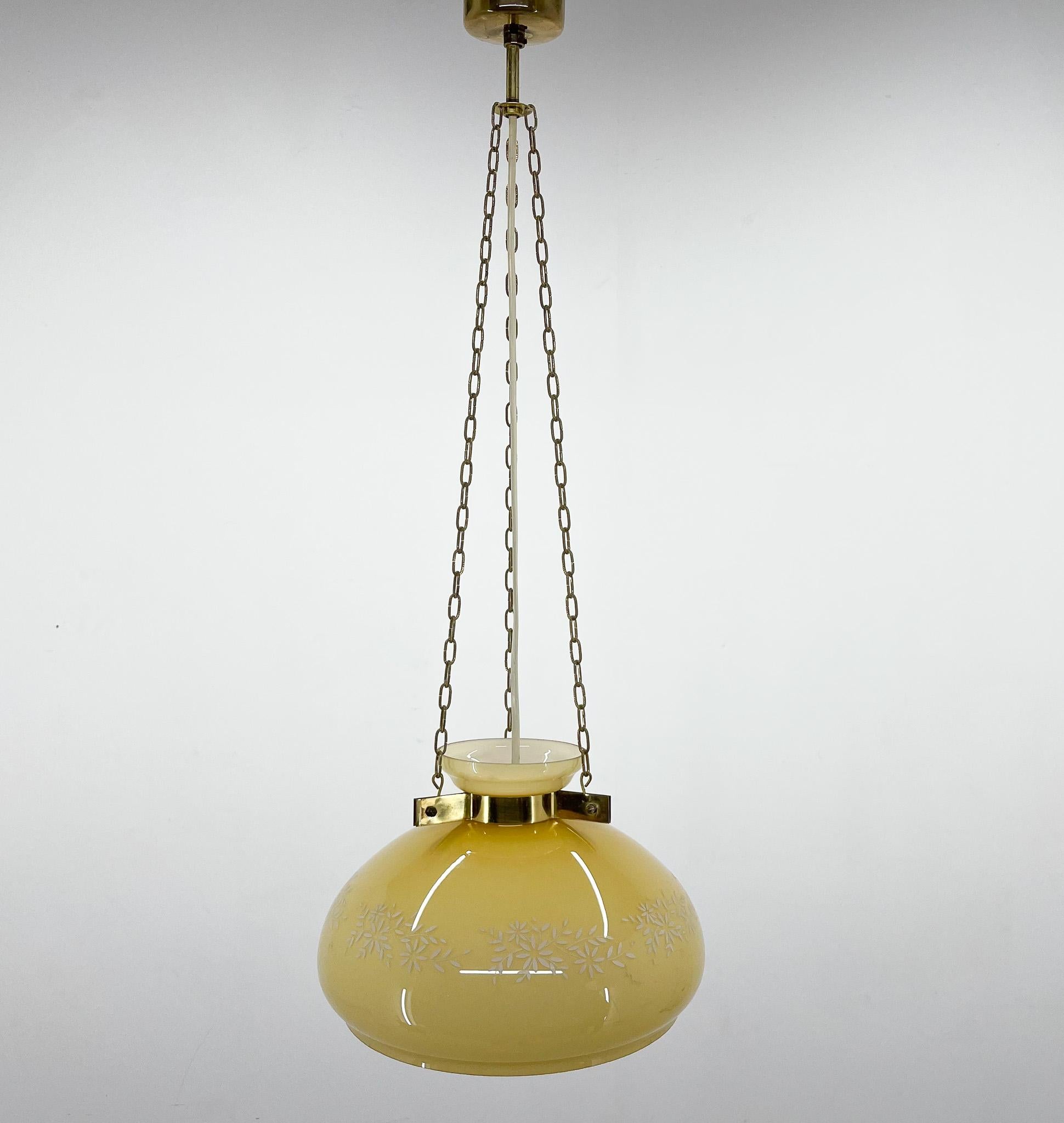 Beautiful mid-century pendant light, made of glass with painted flower pattern on brass chains. Bulbs: 1 x E25-E27.