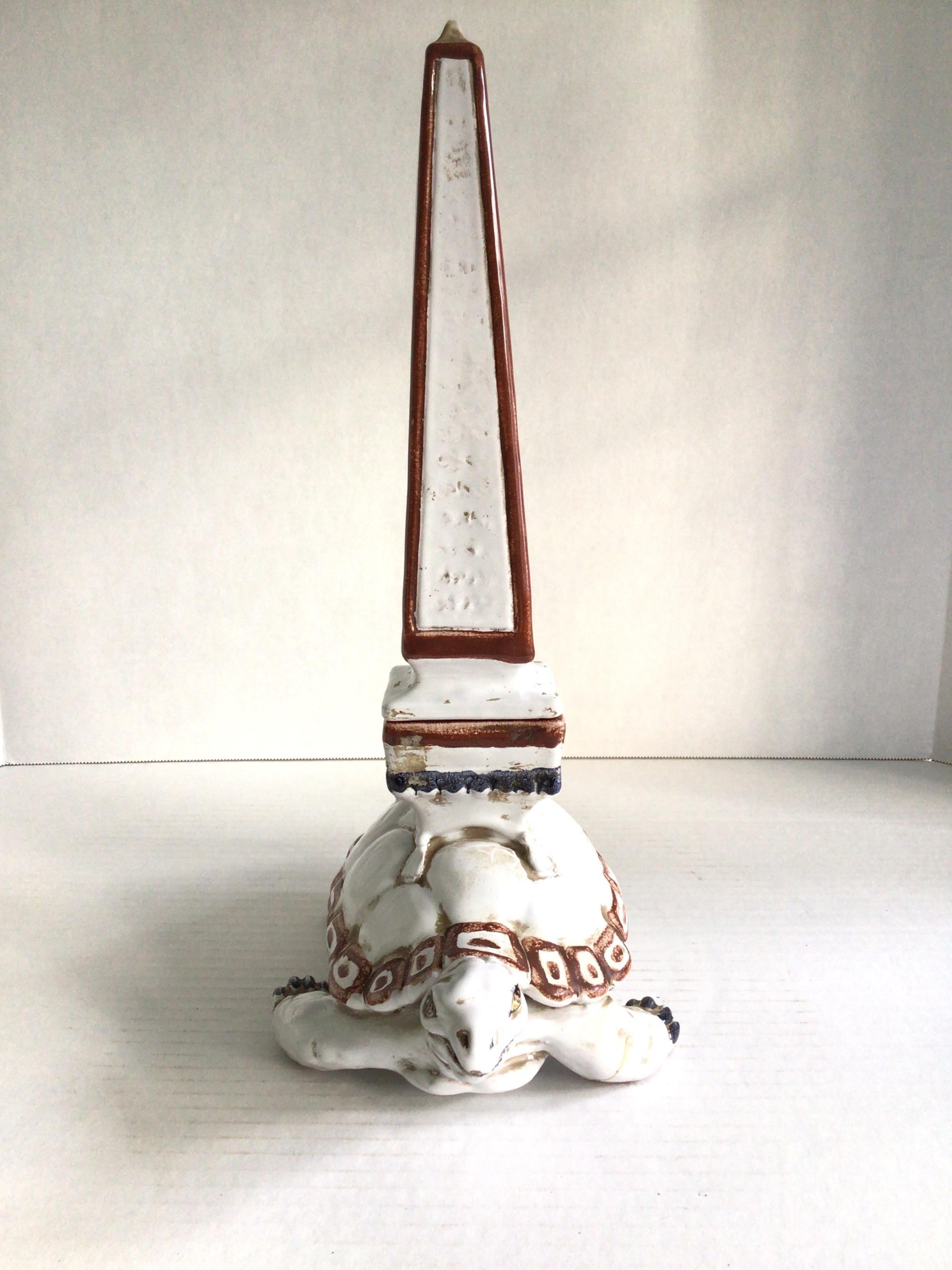 1950s Glazed Ceramic Obelisk with Turtle Base
Made in Italy
Obelisk separates from base (as shown in pictures)
Right leg has been repaired (as shown in pictures) repaired nicely
