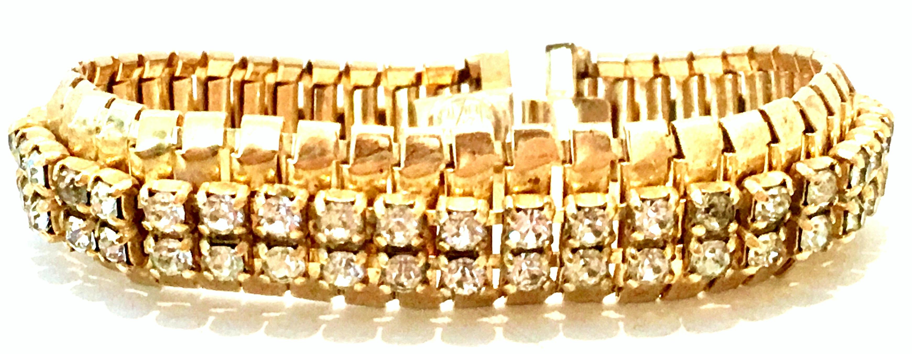 1950'S Gold Plate & Swarovski Crystal Rhinestone Link Bracelet By, Jewels By Julio.
Features prong set crystal clear rhinestones and locking clasp. Signed on the underside, Jewels By Julio.