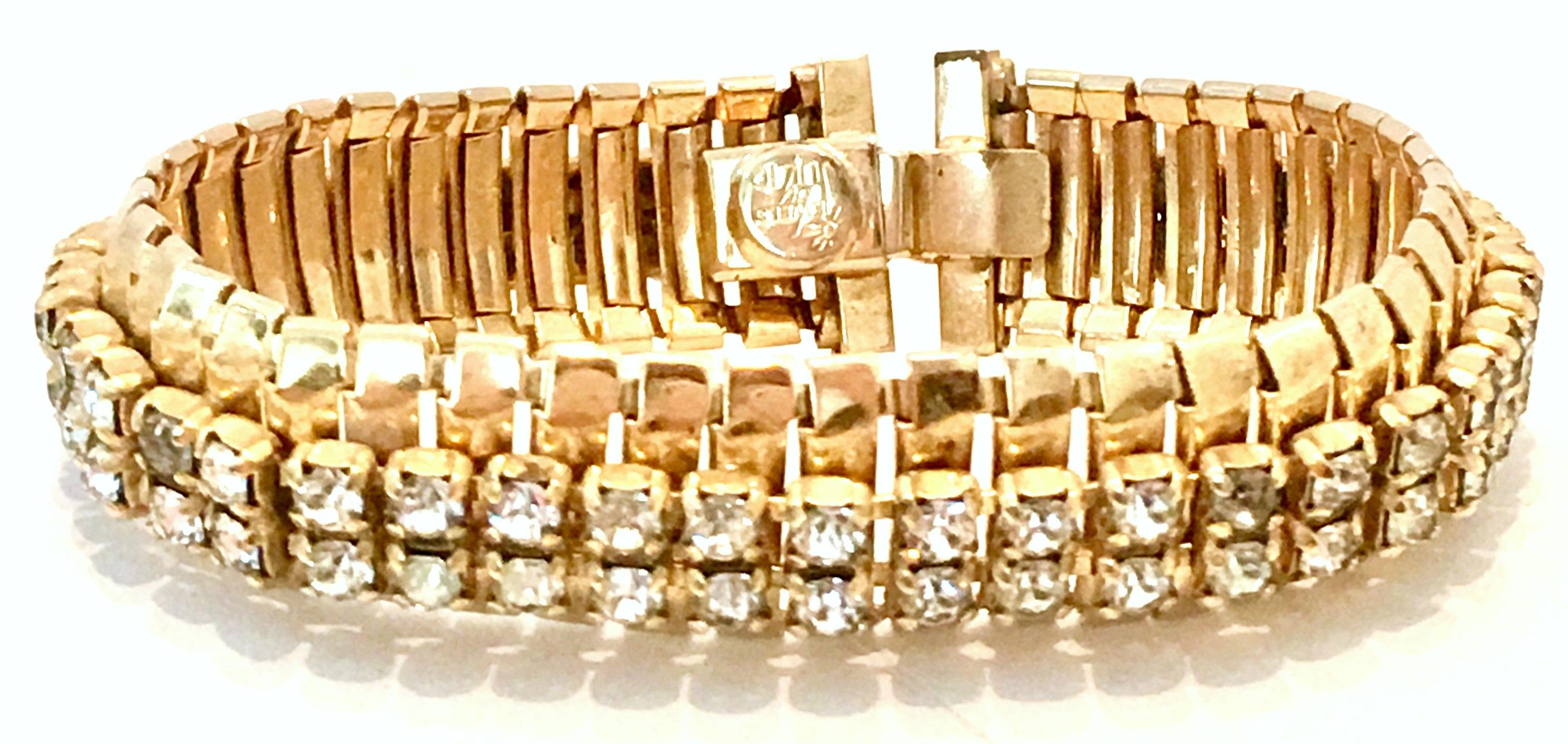 1950'S Gold Plate Link & Swarovski Crystal Rhinestone Bracelet By, Jewels By Julio.
Features prong set crystal clear rhinestones and locking clasp. Signed on the underside, Jewels By Julio.