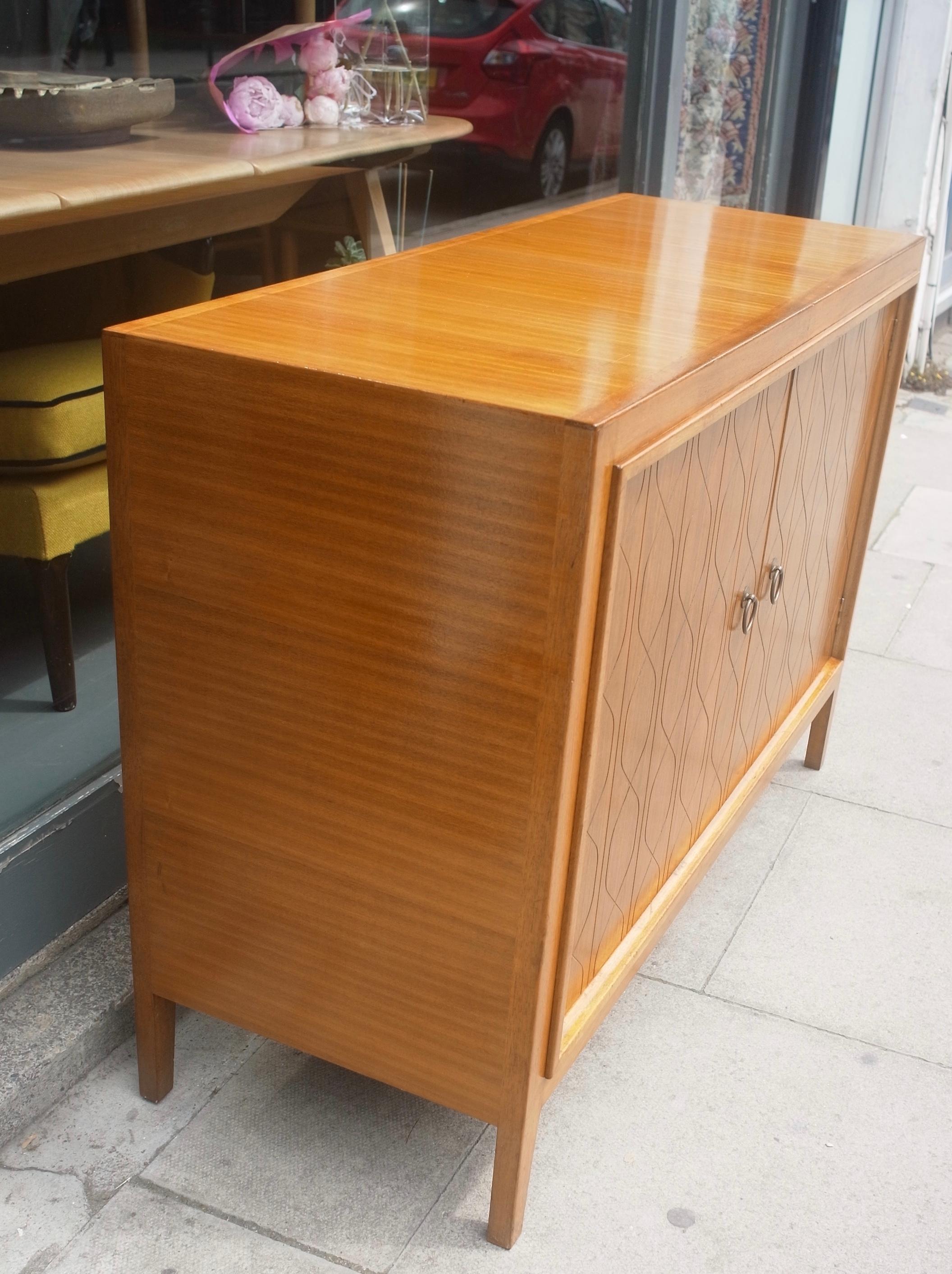 1950s Mahogany and Hardwood sideboard designed by David Booth and Judith Ledeboer for Gordon Russell of Broadway. 
Model 407 originally exhibited at the Festival of Britain in 1951, later went into production in 1953, and has become an iconic piece