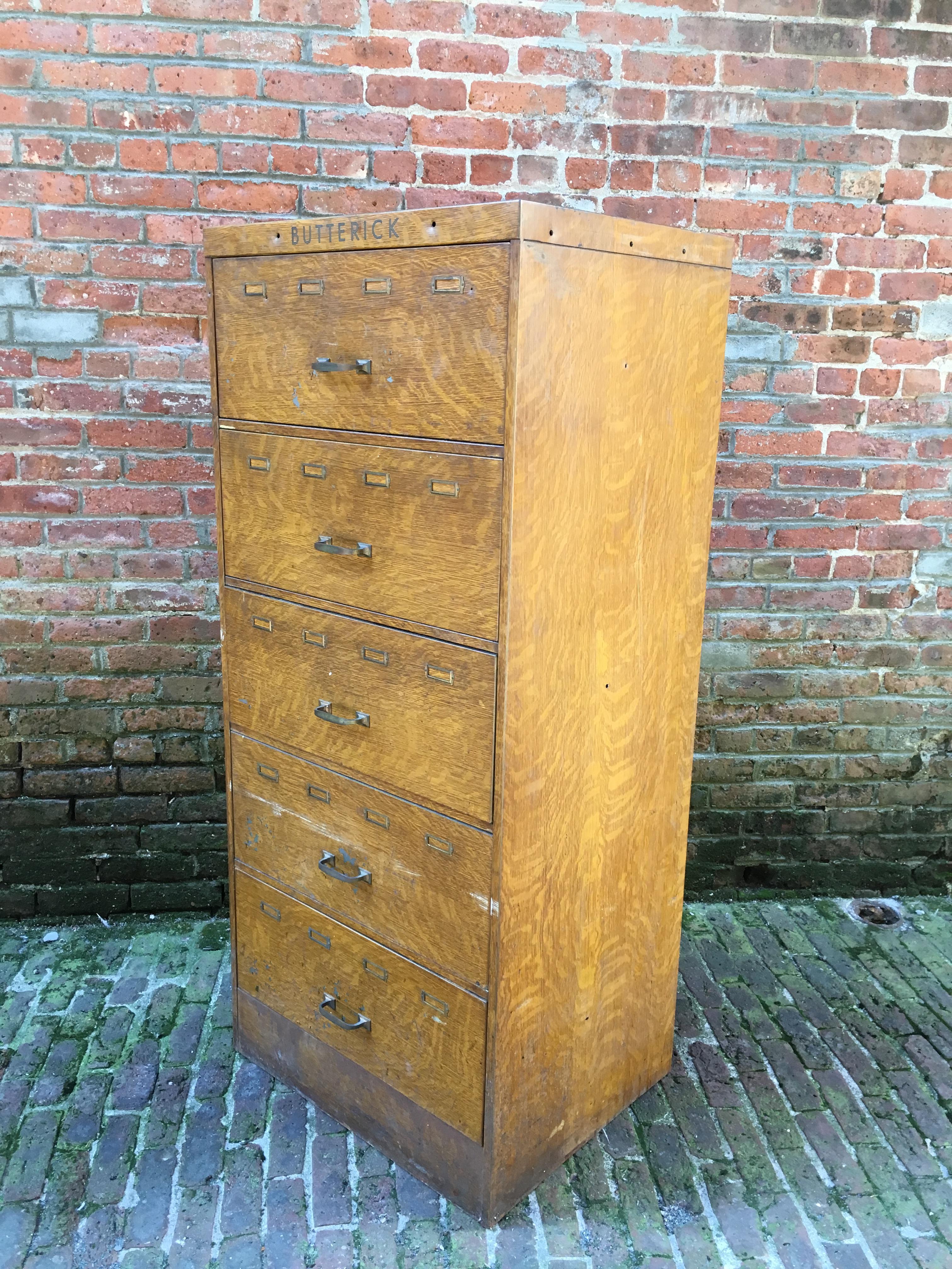 Quarter sawn oak printed metal cabinet for Butterick patterns. My Mom sewed a lot of my sister's clothing when we were children. I remember going to the fabric store where she would find the pattern in a catalog and then retrieve the correct pattern