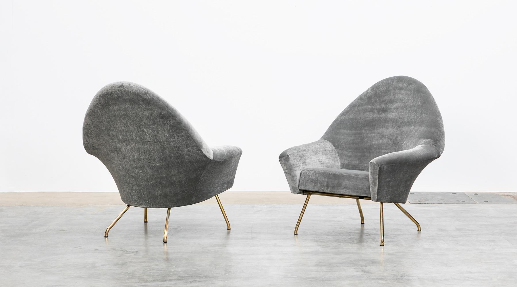 New upholstery in grey high-quality fabric, lounge chairs by Joseph-André Motte, France, 1955.

These two lounge chairs from 1955, designed by French Joseph-André Motte, are timeless in shape and aesthetics. Organically shaped seat shell countered