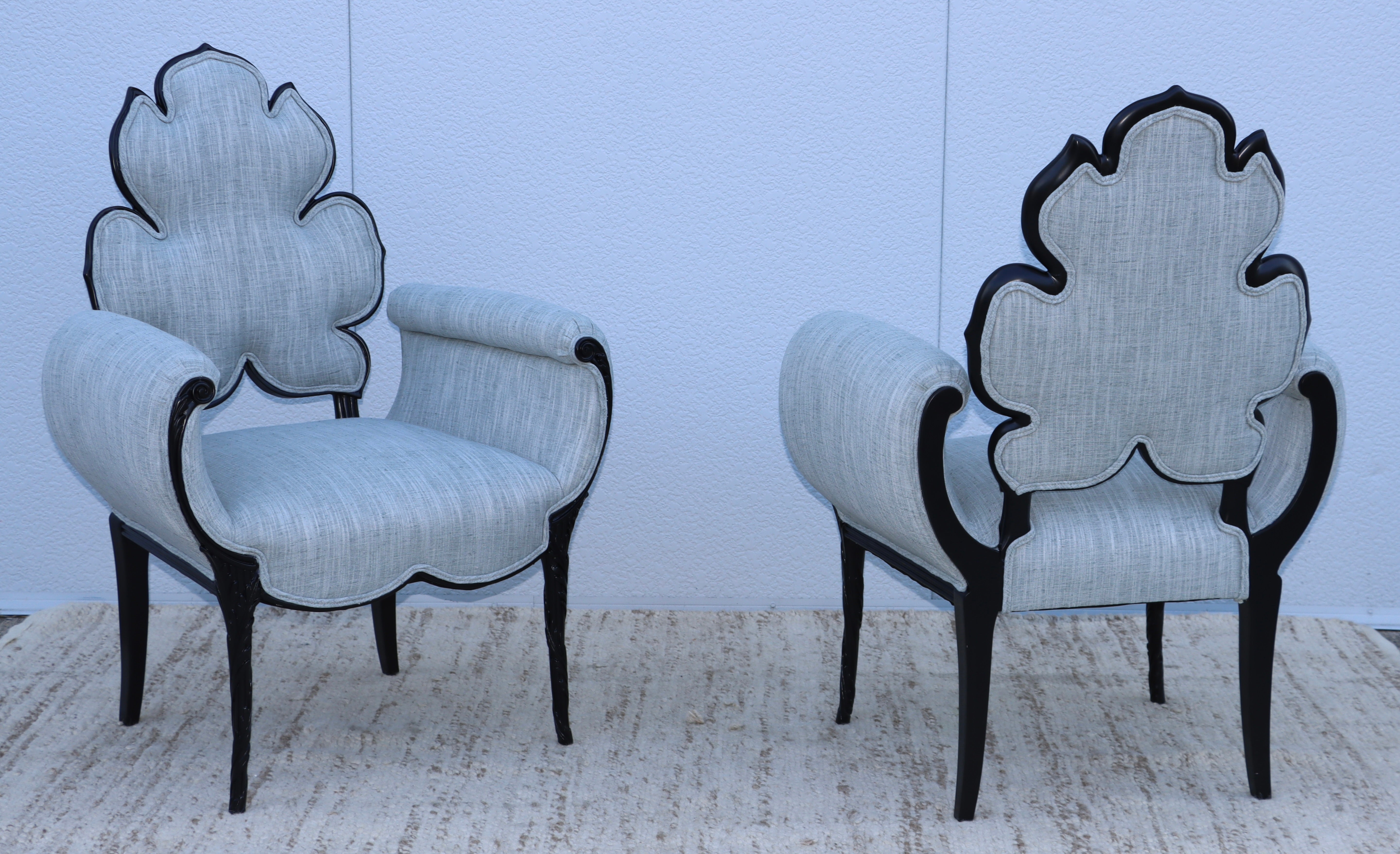 1950's Grosfeld House flower back lounge chairs, fully restored in black lacquer and newly re-upholstered in linen blend Donghia fabric, with minor wear and patina due to age and use.