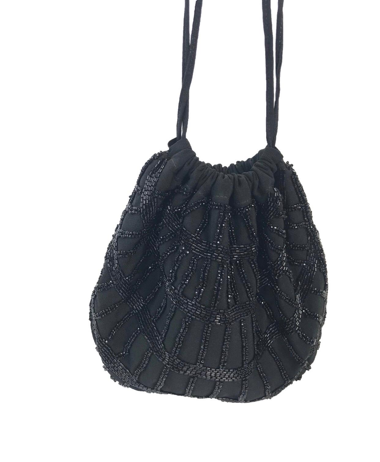1950's GUCCI black beaded silk evening bag. One interior pocket. Stamped Gucci made in Italy. Condition: Excellent, looks new. 

 