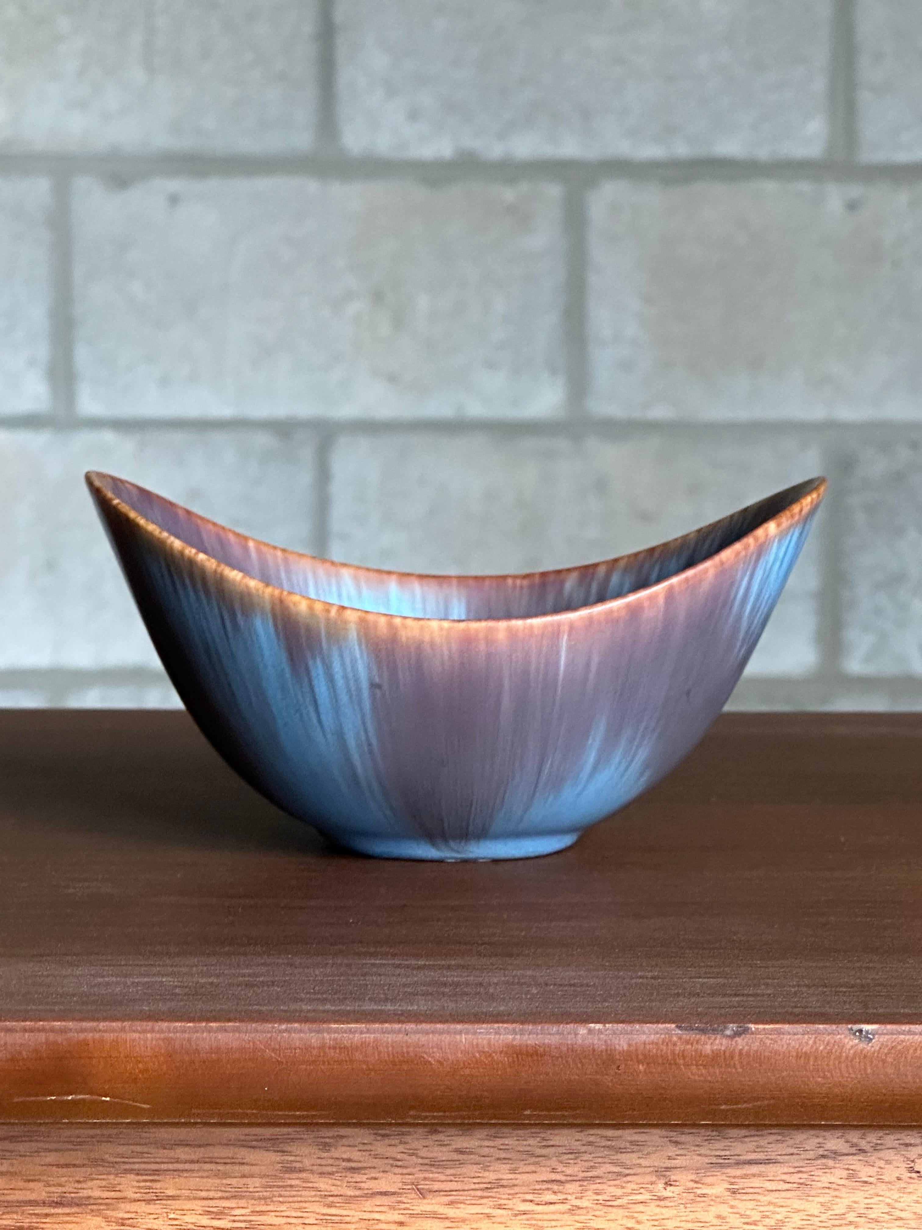 A ceramic bowl designed by Gunnar Nylund for Rörstrand circa 1950s. Gorgeous glaze and great movement with the bowl, this could work in a variety of interiors.

Other notable ceramicist from the period include Carl-Harry Stalhane, Guido Gambone,