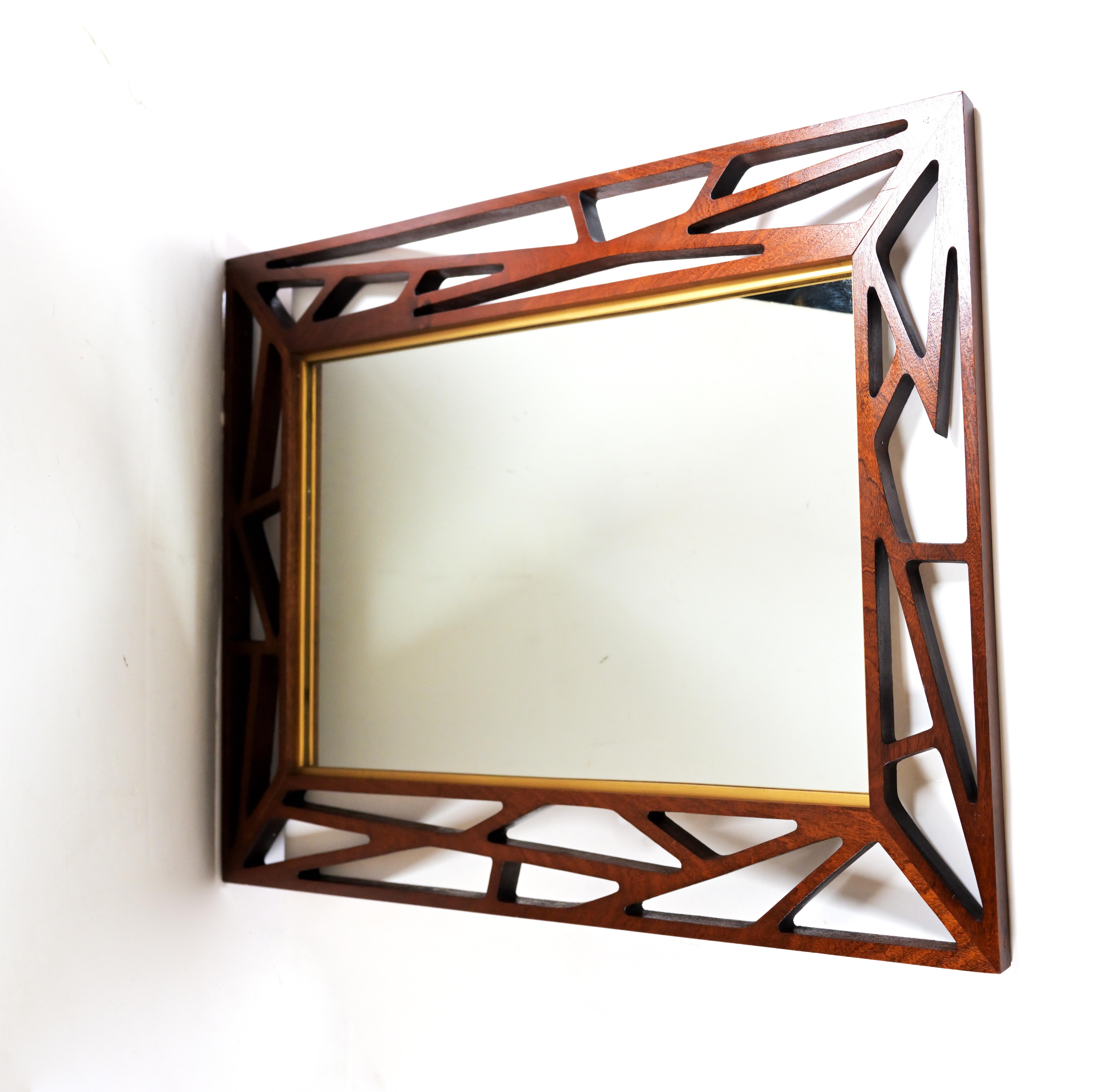 A teak mirror by Swedish Designer Gustaf Eden Spegalfabrik having original webbing teak design.