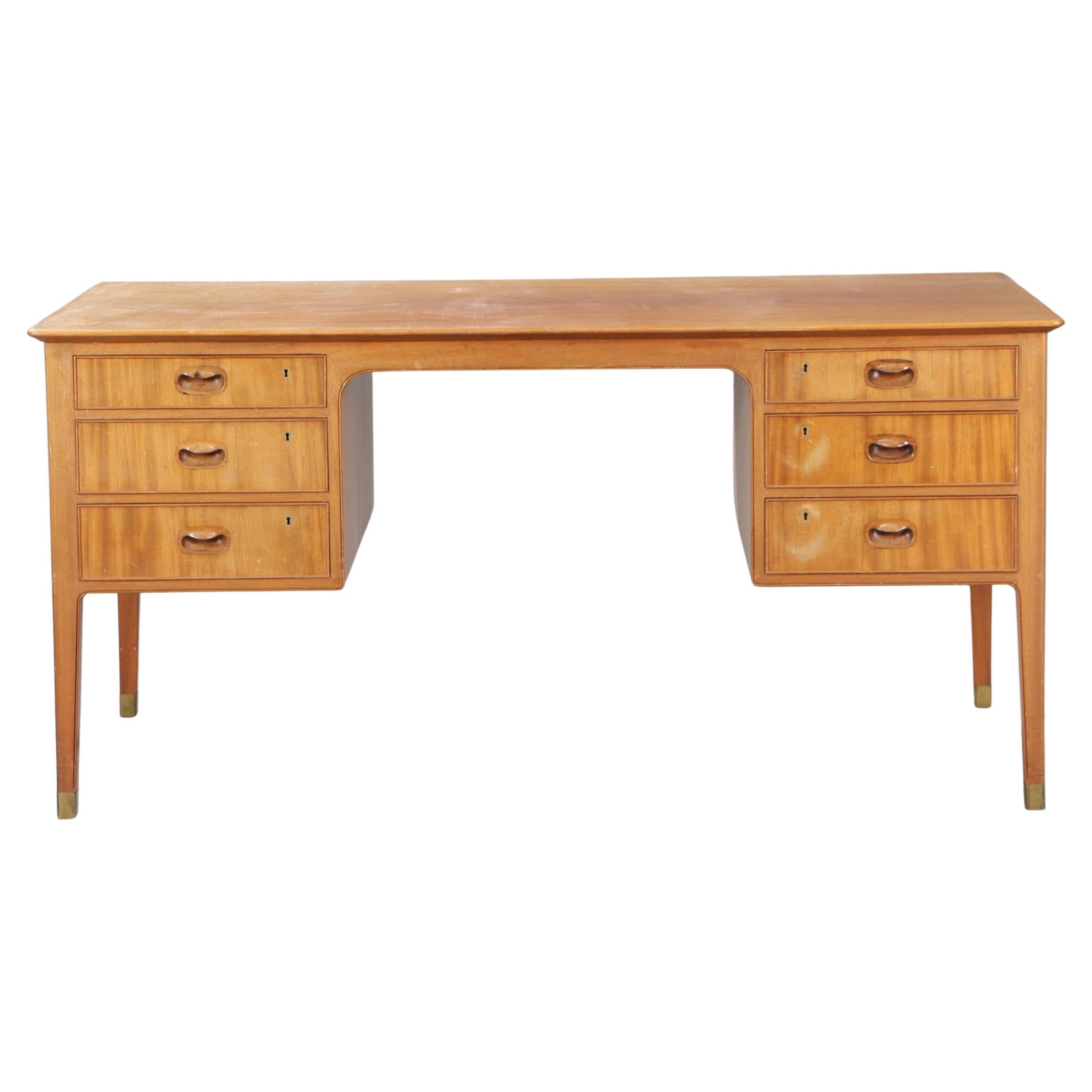 1950s Gustav Bertelsen desk with brass shoes and six drawers