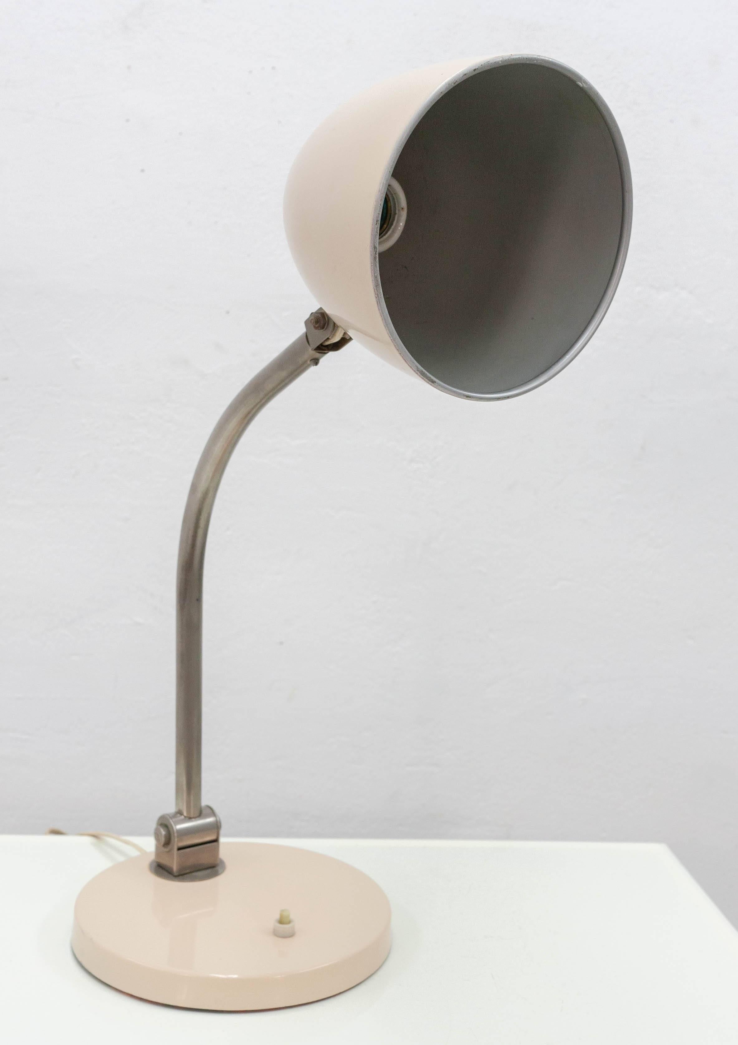 1950s Hala Zeist desk lamp in its original warm beige color. Features a flexible metal arm allowing it a wide range of motion. All original and signed in the hardware.