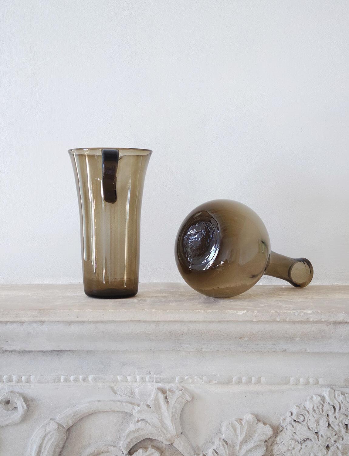 A hand-blown Empoli Glass water jug/pitcher AND wine bottle in brown / grey coloured glass. Made in Empoli in the 1950s, this bottle was found alongside a very few remaining pieces of Empoli Glass. Empoli is the town in Tuscany renowned for its