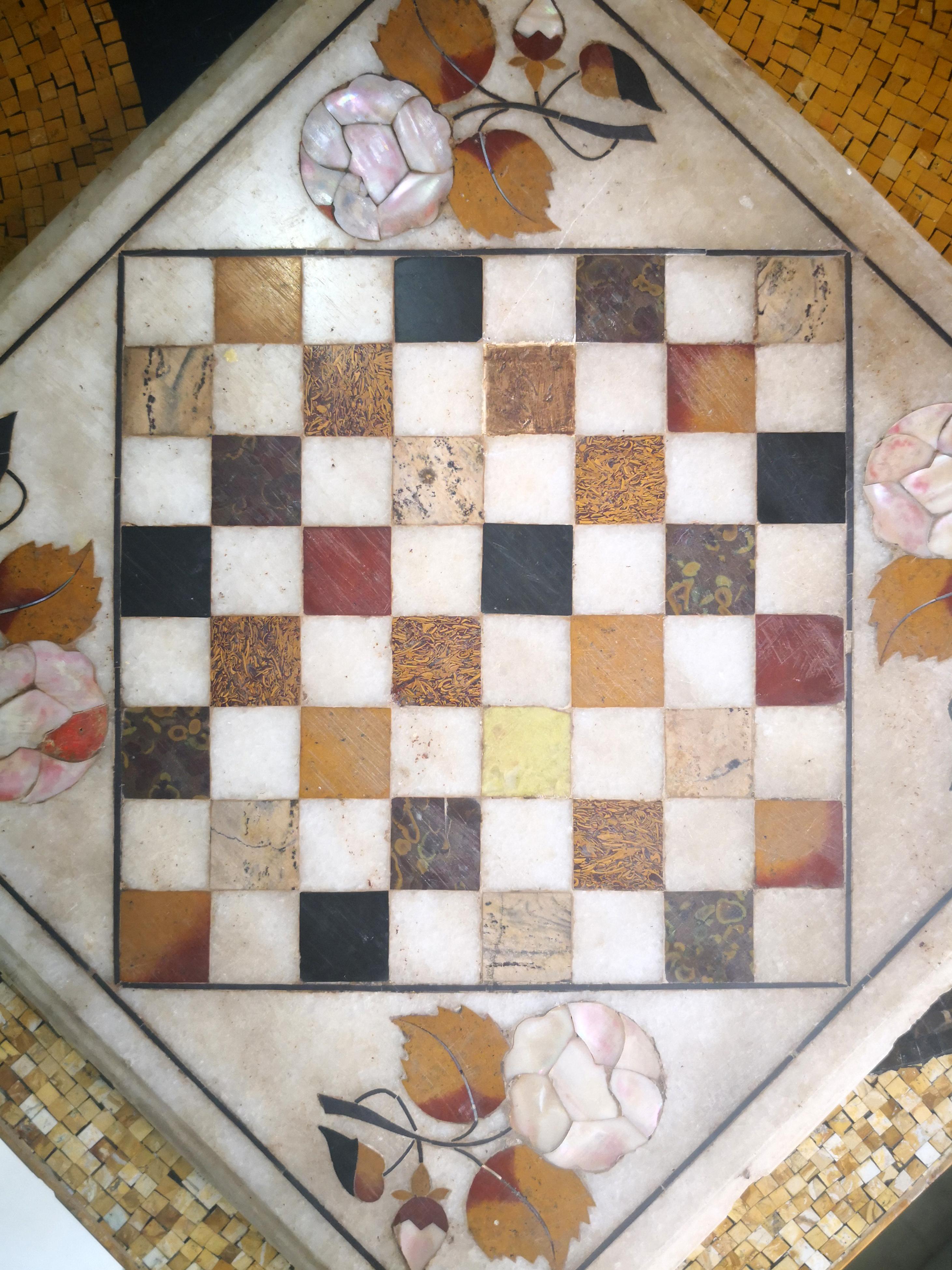 1950s hand-carved marble chess board in Italian Pietre Dure inlay mosaic, using semiprecious stones and marbles, including mother of pearl and oceanic jasper.

 