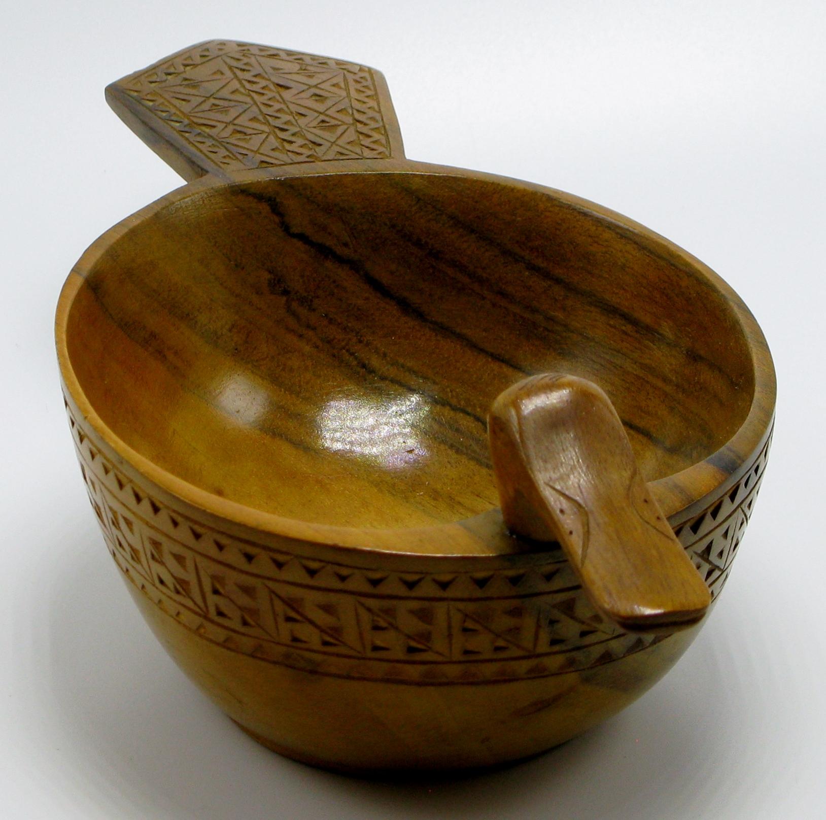 Olive wood duck serving bowl hand carved by a shepherd in the mountains of Yugoslavia, circa 1950s.