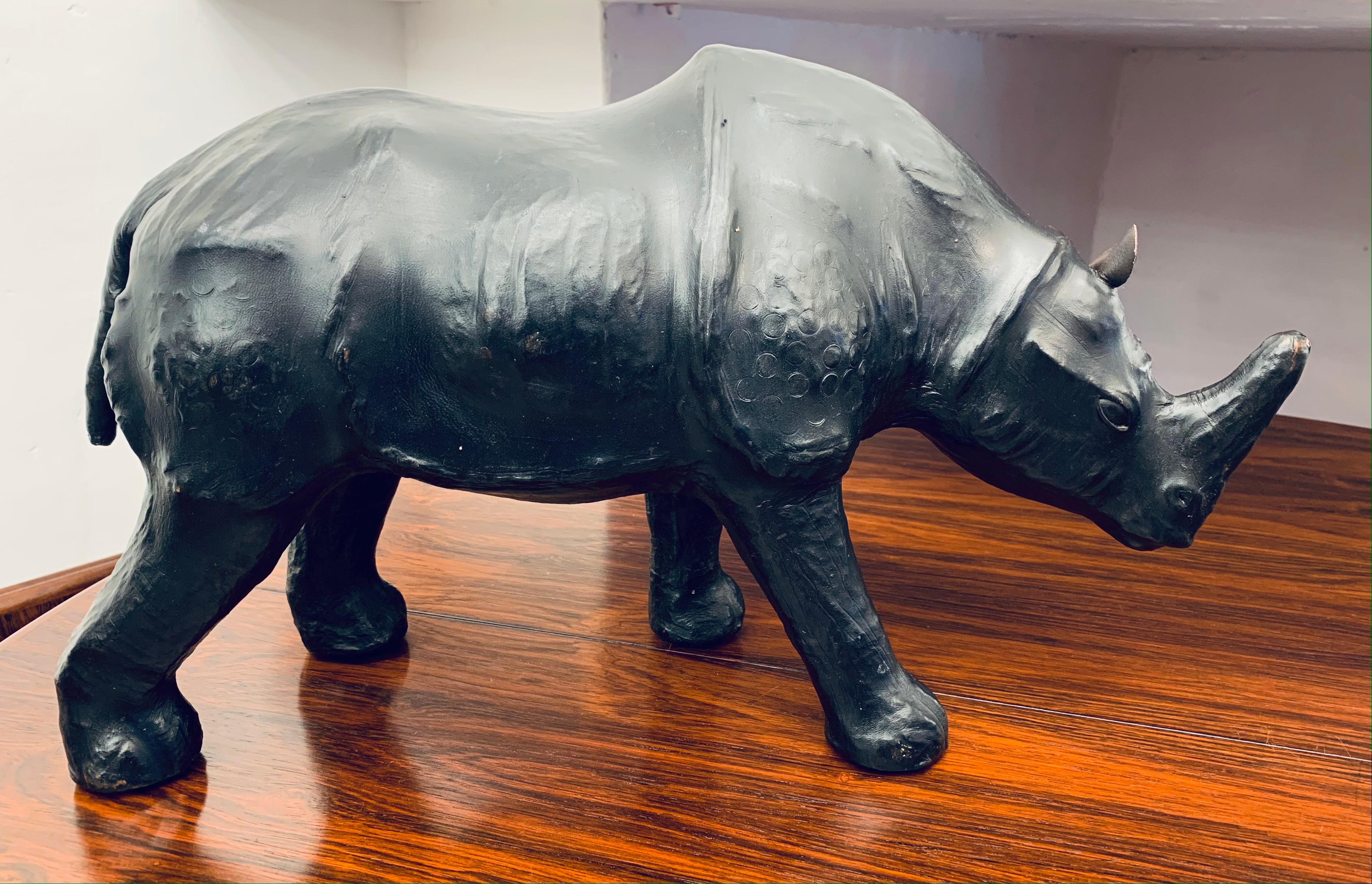 A wonderful, well-made, unusual and rare, Liberty’s of London, Omersa style, hand-dyed leather Rhinoceros decorative ornament or small footstool. After some research I've dated this Rhino to around to the 1950s although they were originally made in